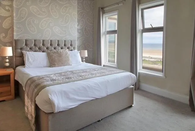 Bed in The Marine Hotel