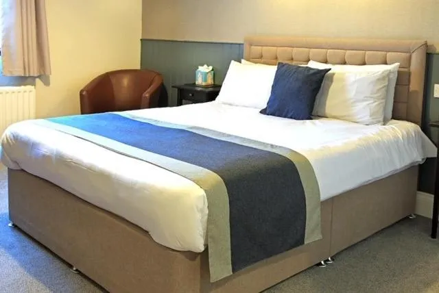 Bed in The Marine Hotel