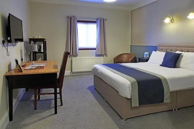 Bed in The Marine Hotel