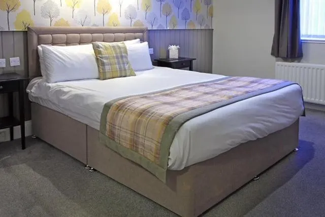 Bed in The Marine Hotel