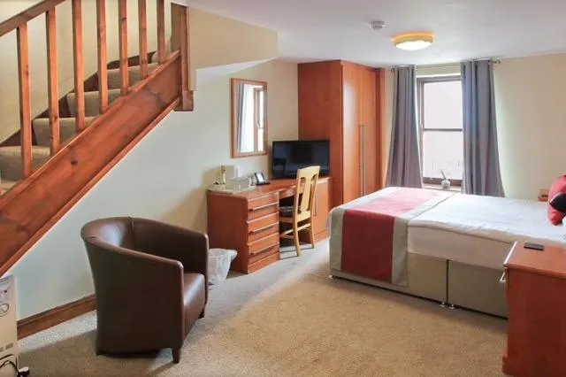 Bed in The Marine Hotel