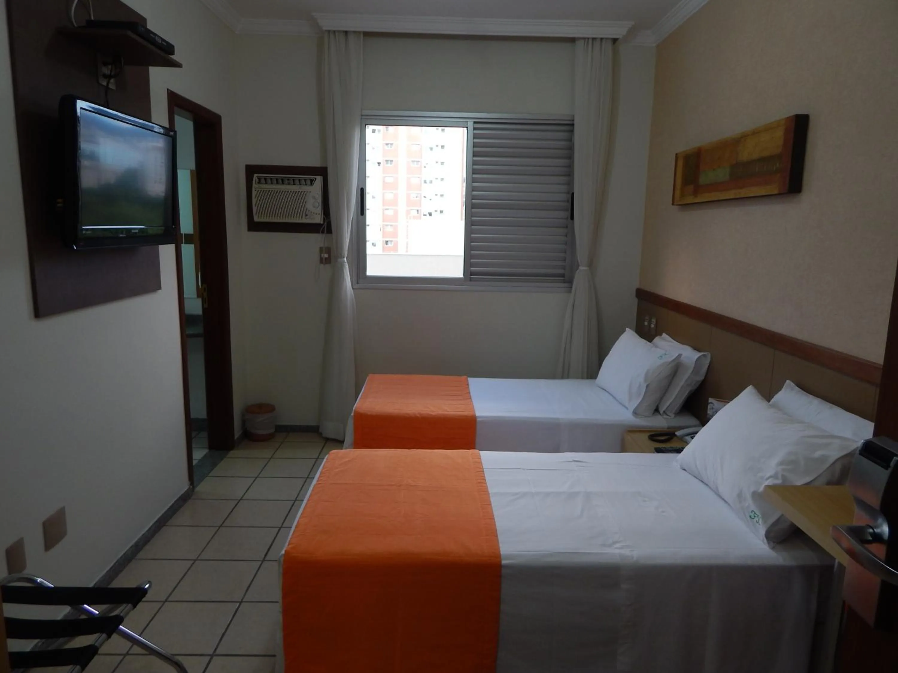 TV and multimedia, Bed in Frimas Hotel