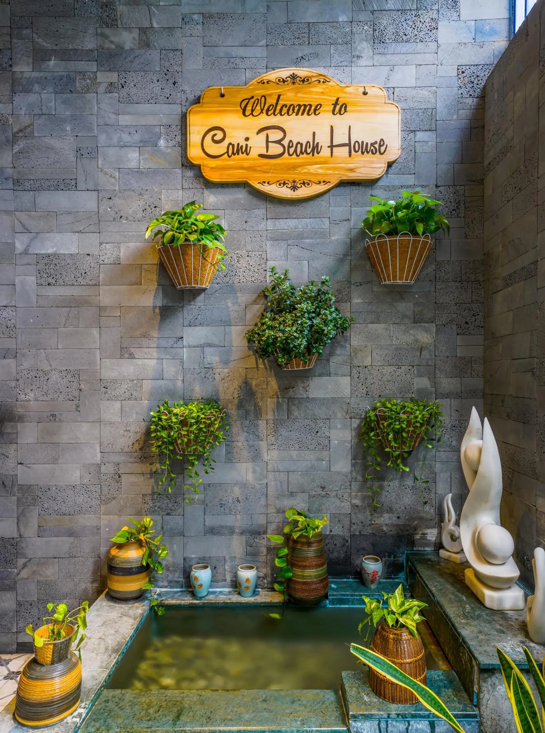 Property logo or sign in Cani Beach House