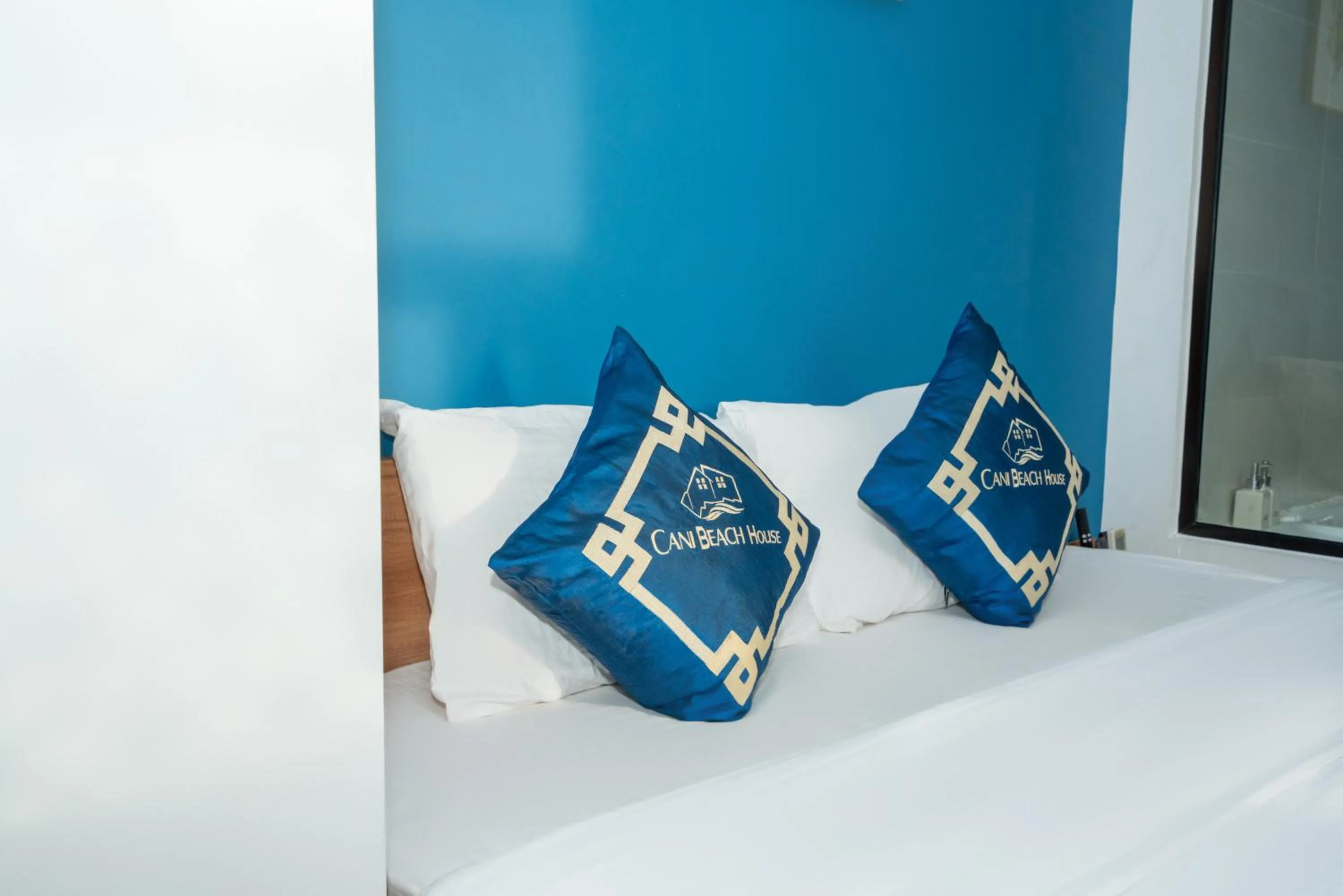 Bed in Cani Beach House