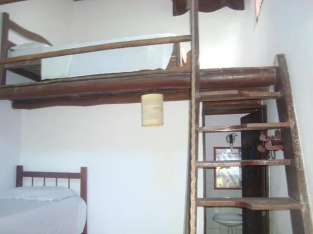 Bed in Pousada O Cantinho