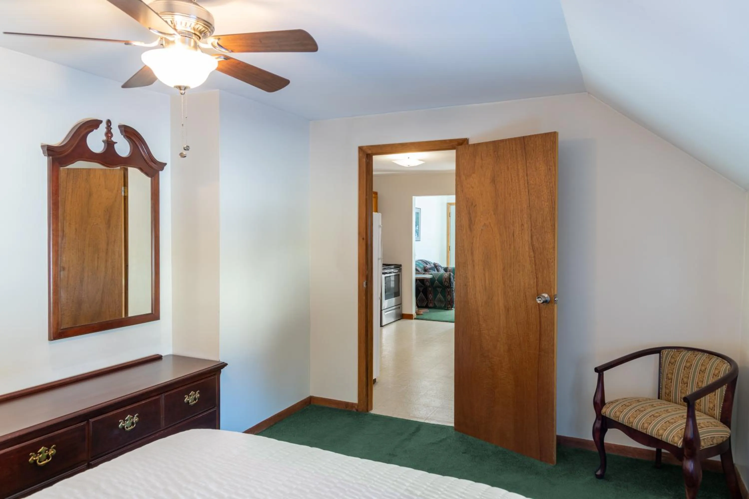 Bed in Sara Placid Inn & Suites