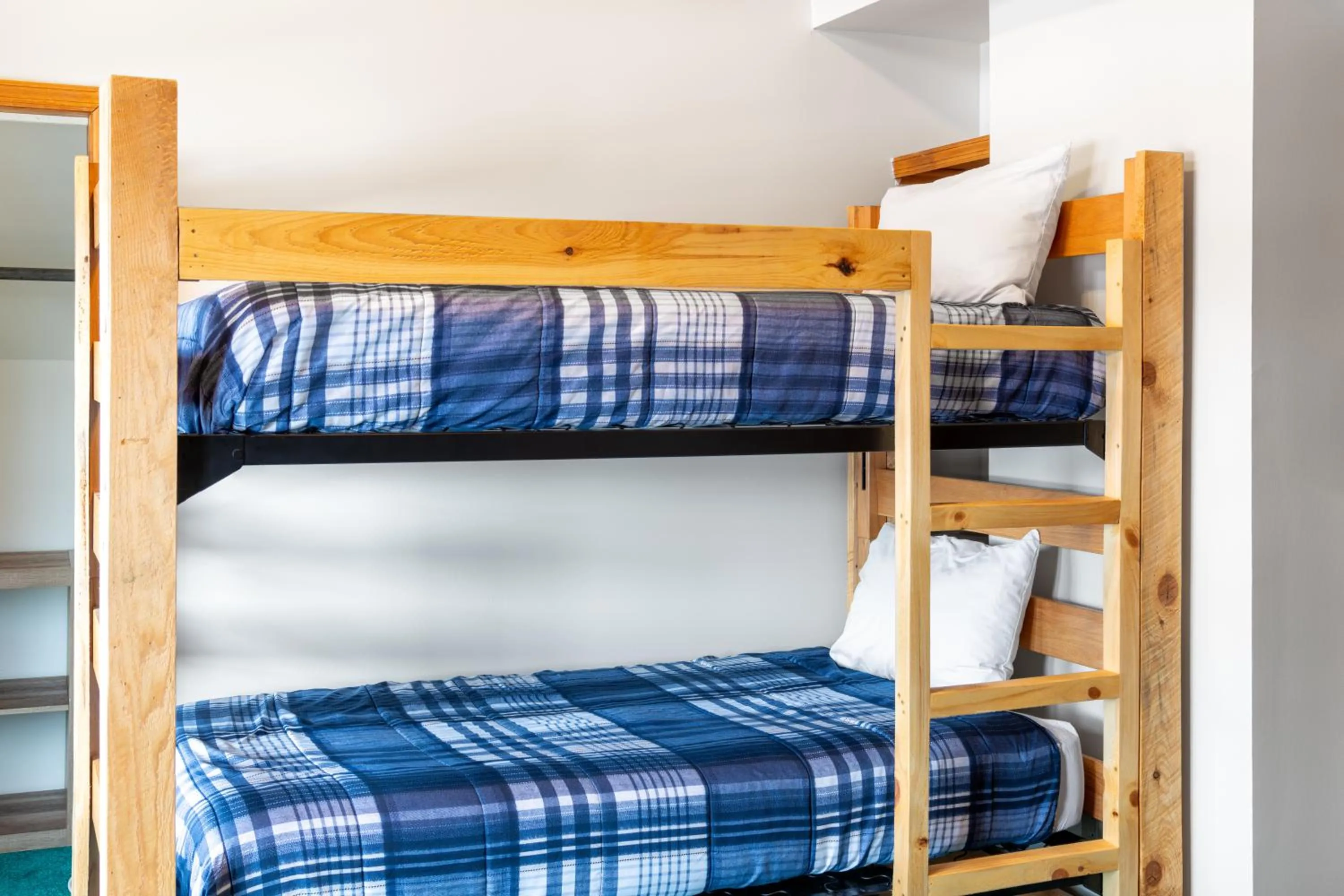 Bed in Sara Placid Inn & Suites