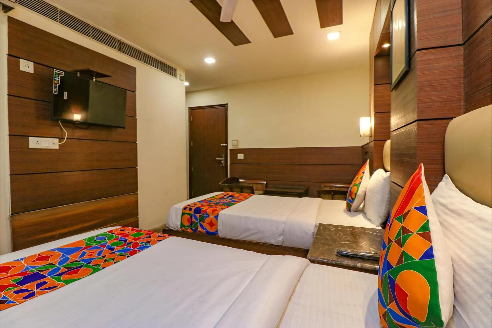 Bed in FabHotel Admire Suites