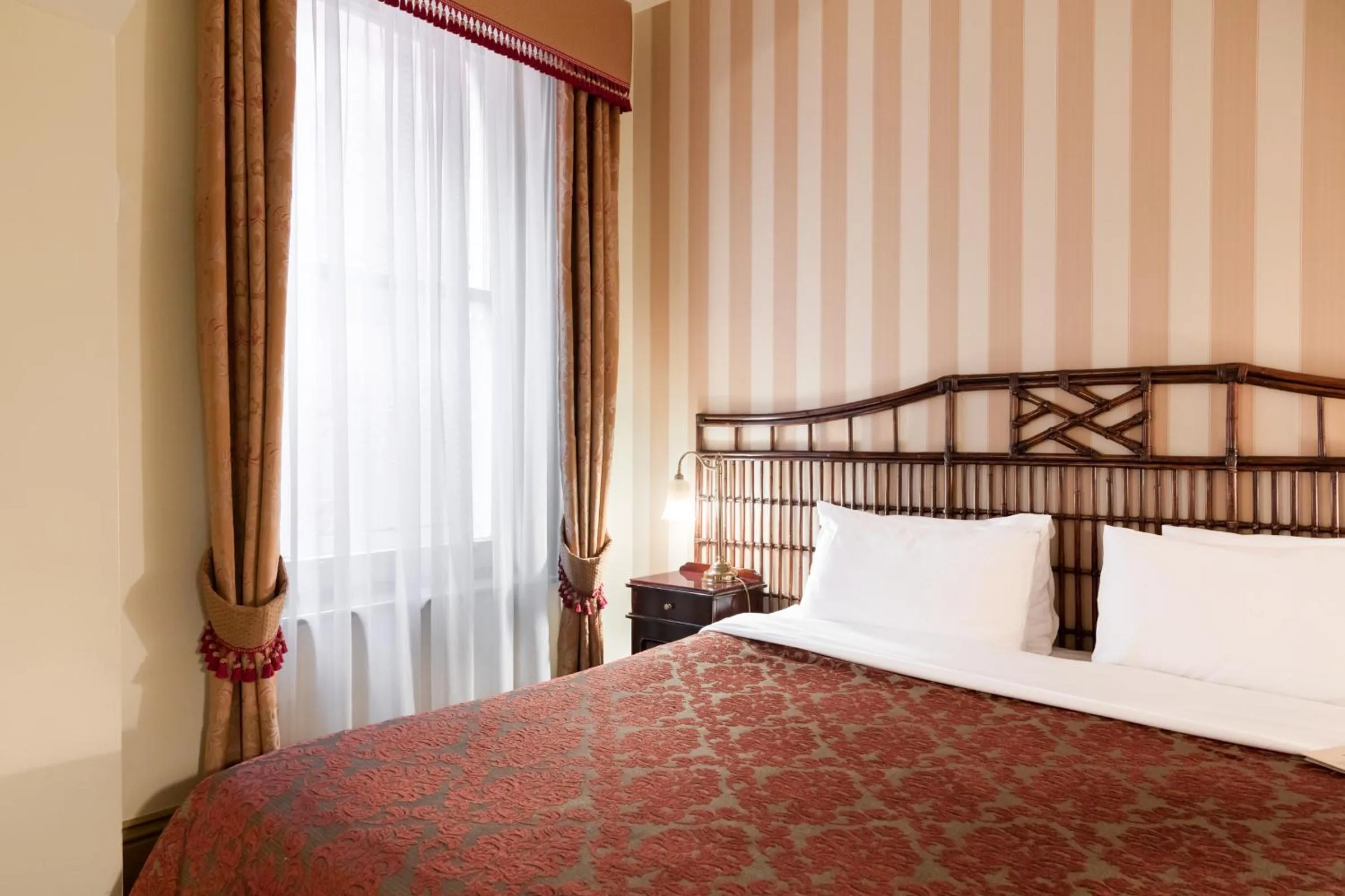 Bed in Hadley's Orient Hotel