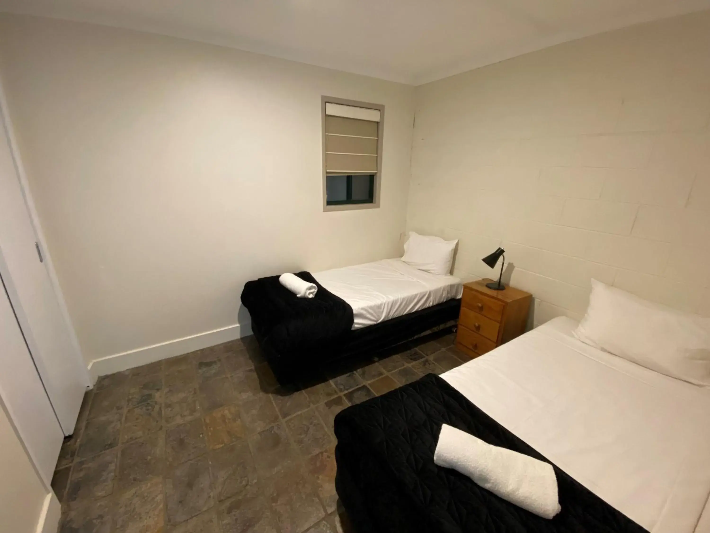 Two-Bedroom Unit with living area and stairs in Tranquil Park Two-Bedroom Unit with living area and stairs in Tranquil Park