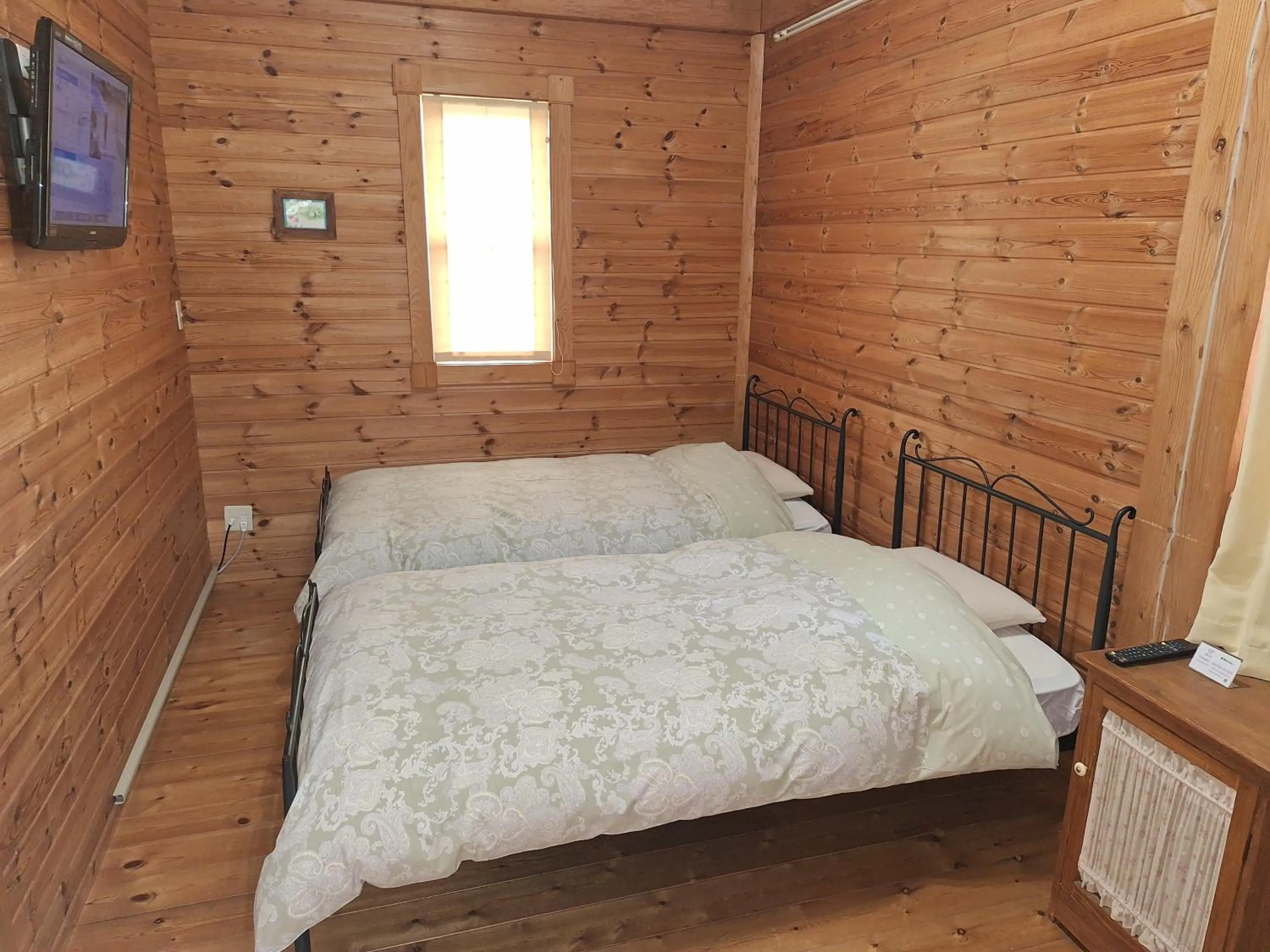 Photo of the whole room, Bed in Lassy Condominium