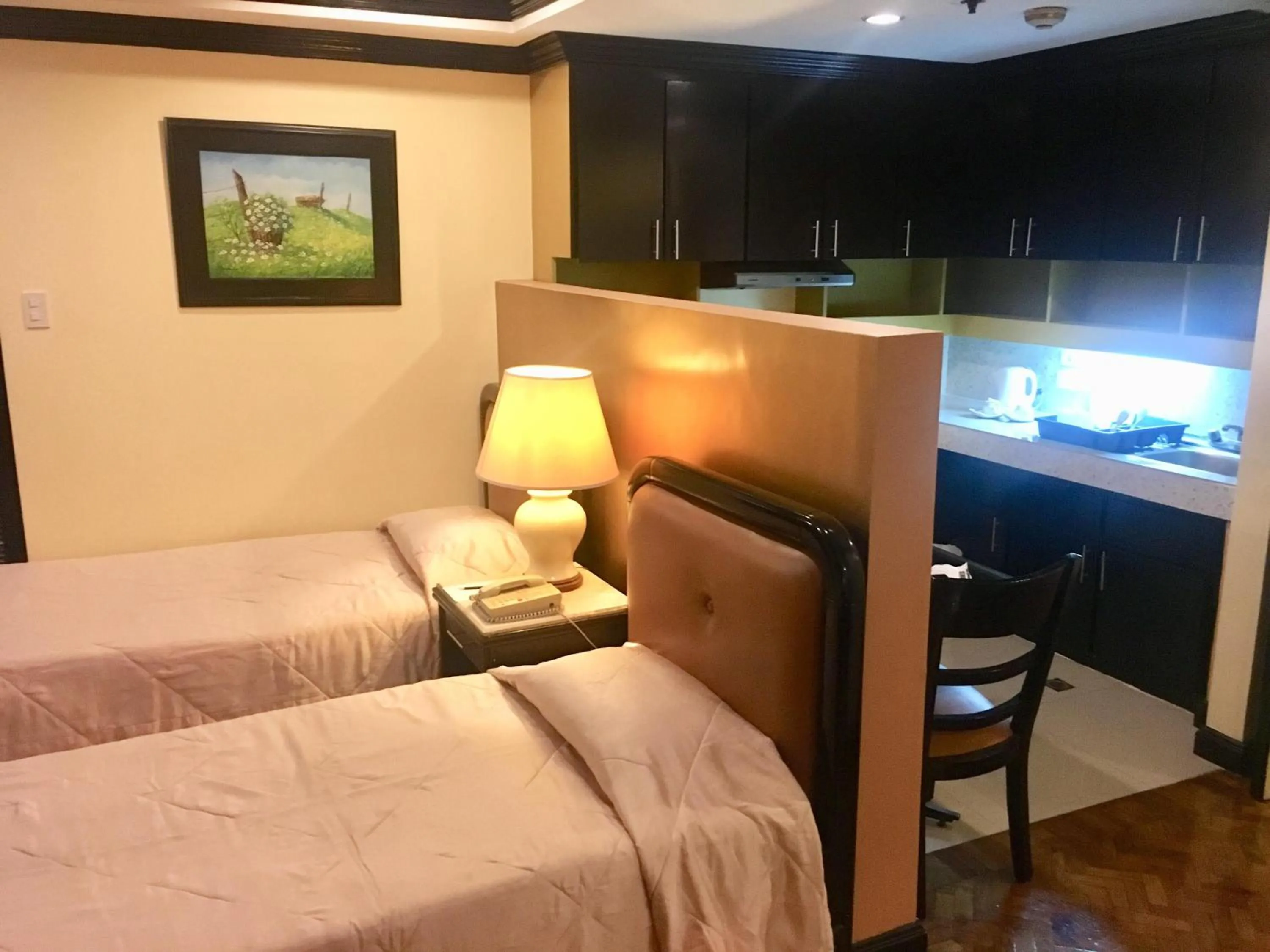 Bed in Lourdes Family Suites Makati powered by Cocotel