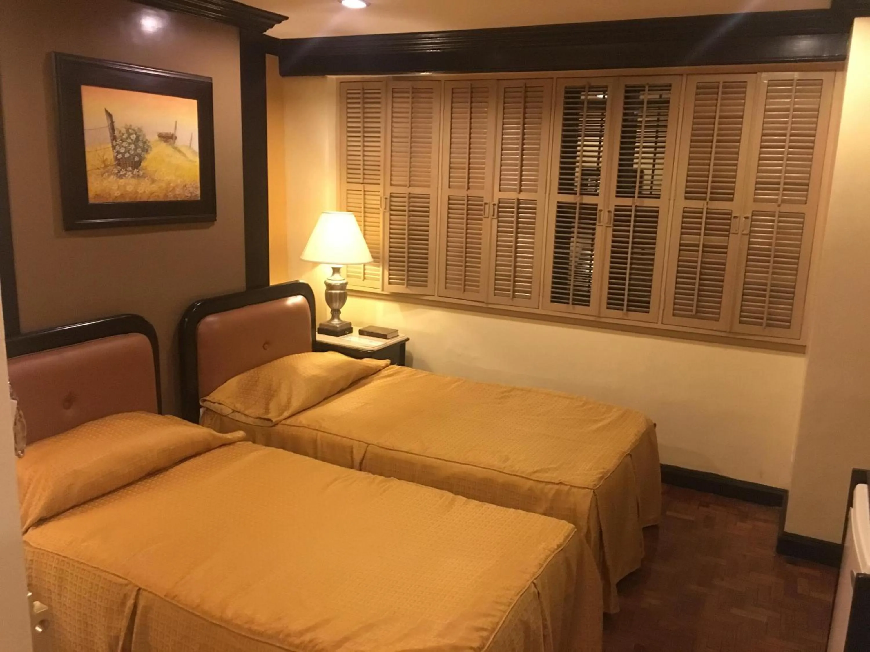 Bed in Lourdes Family Suites Makati powered by Cocotel