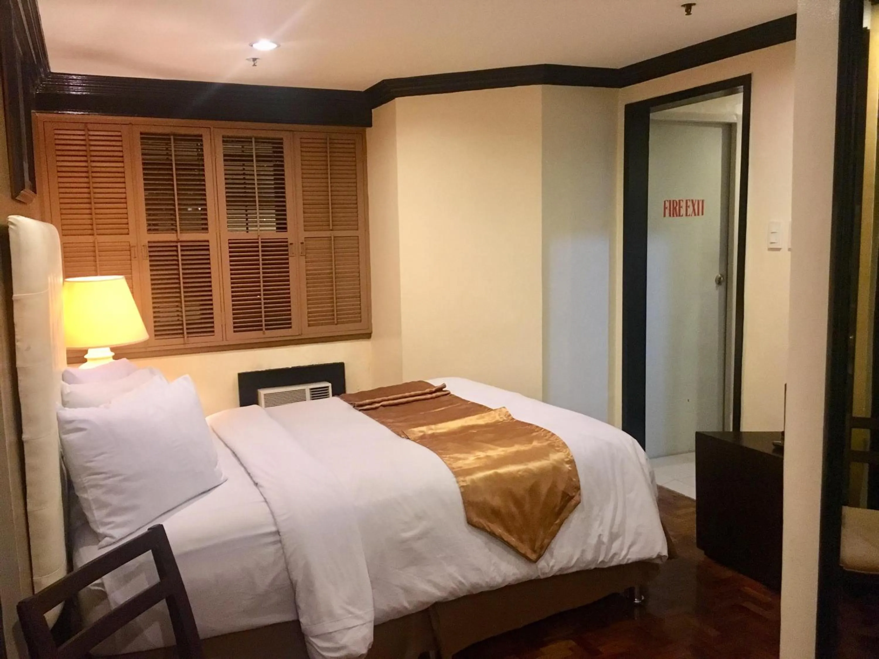 Bed in Lourdes Family Suites Makati powered by Cocotel