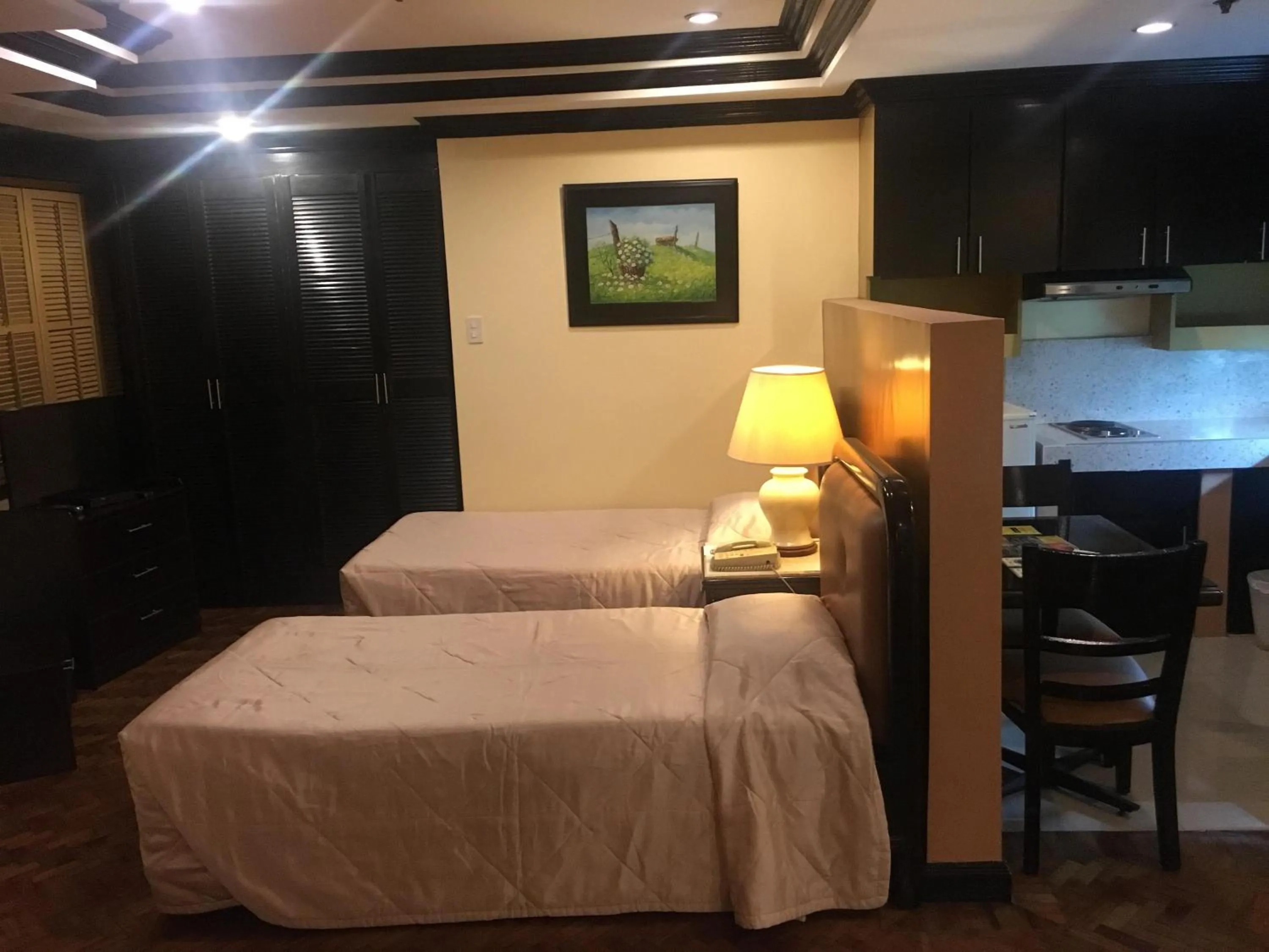 Bed in Lourdes Family Suites Makati powered by Cocotel