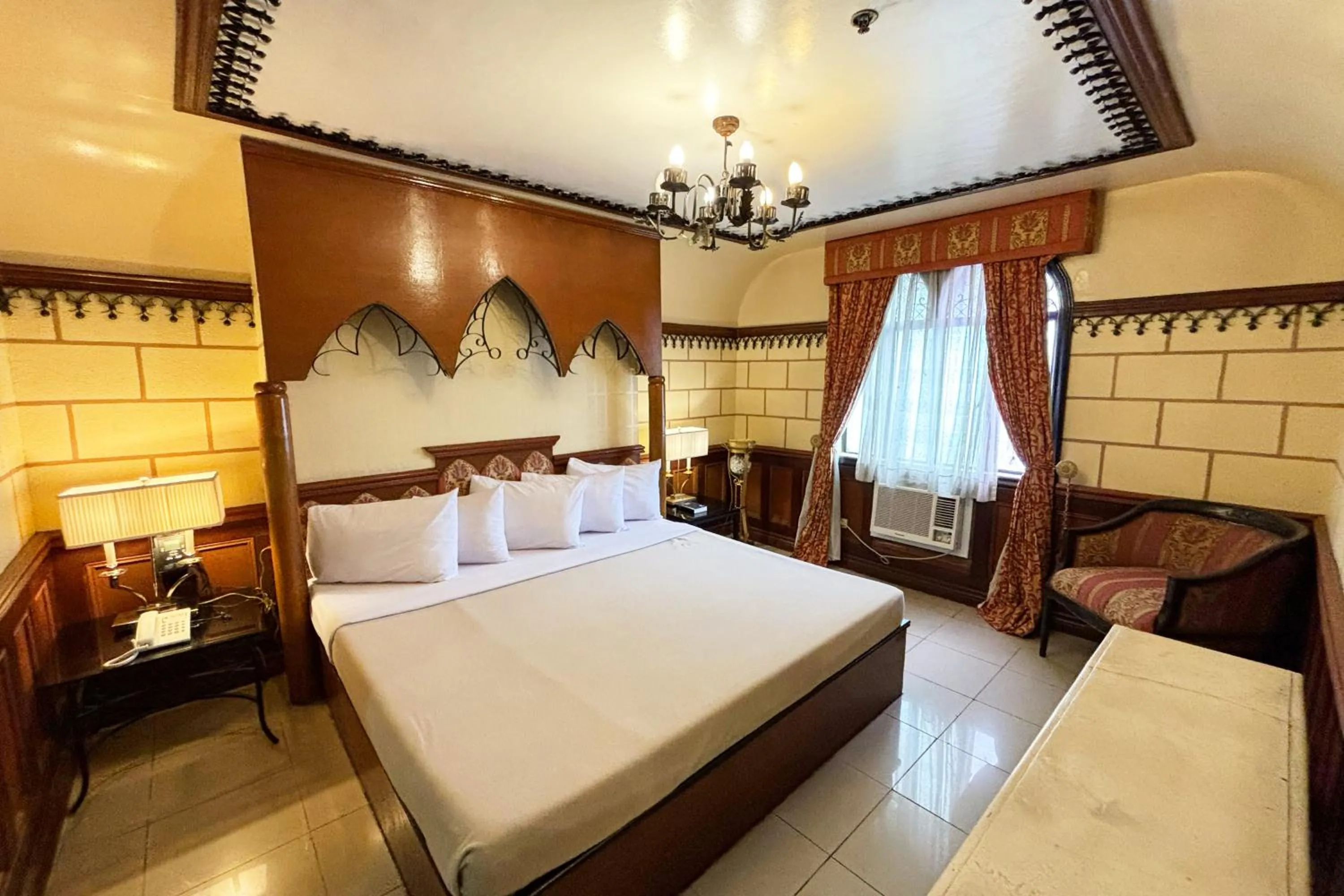 Bed in Camelot Hotel Quezon City powered by Cocotel