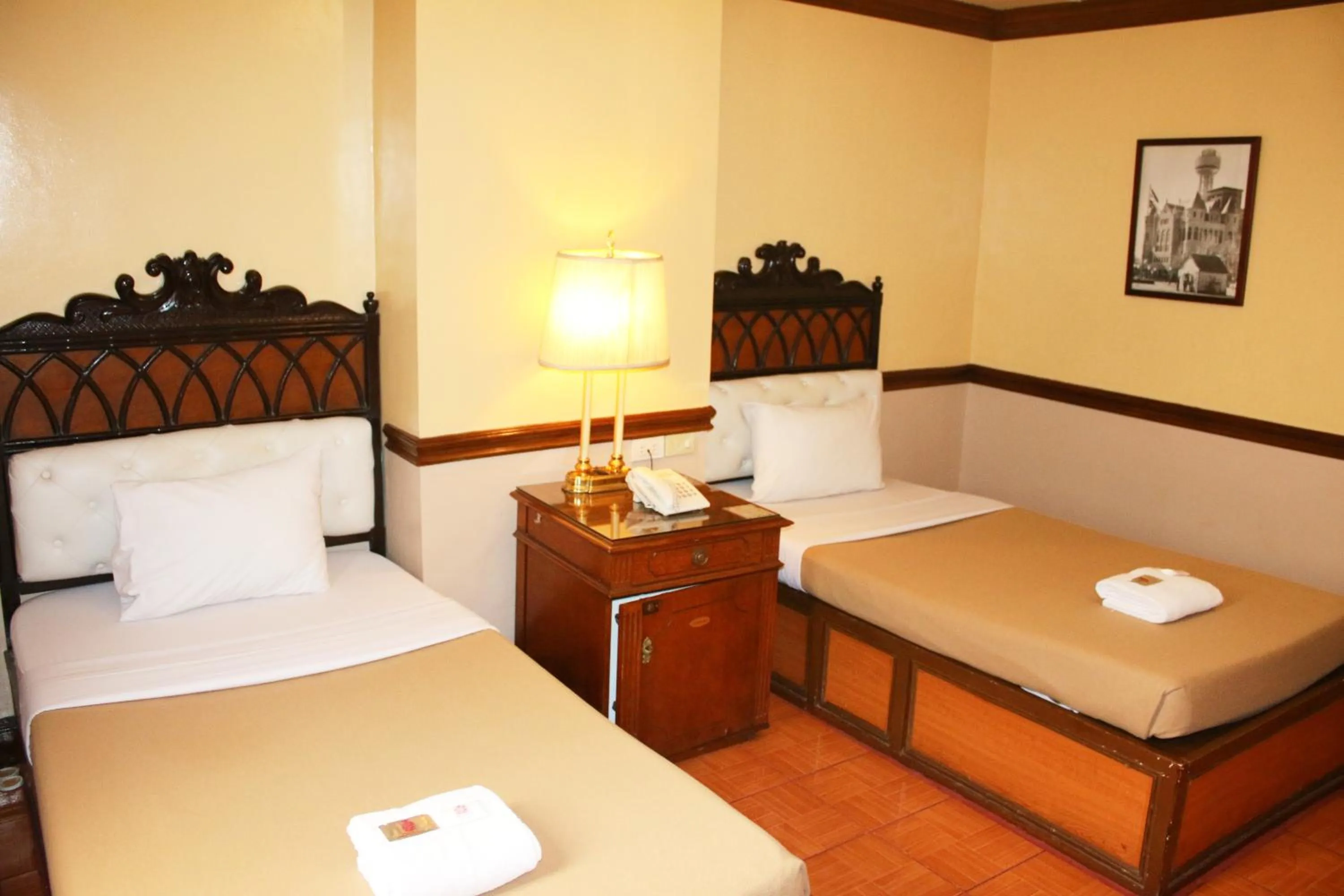 Bed in Camelot Hotel Quezon City powered by Cocotel