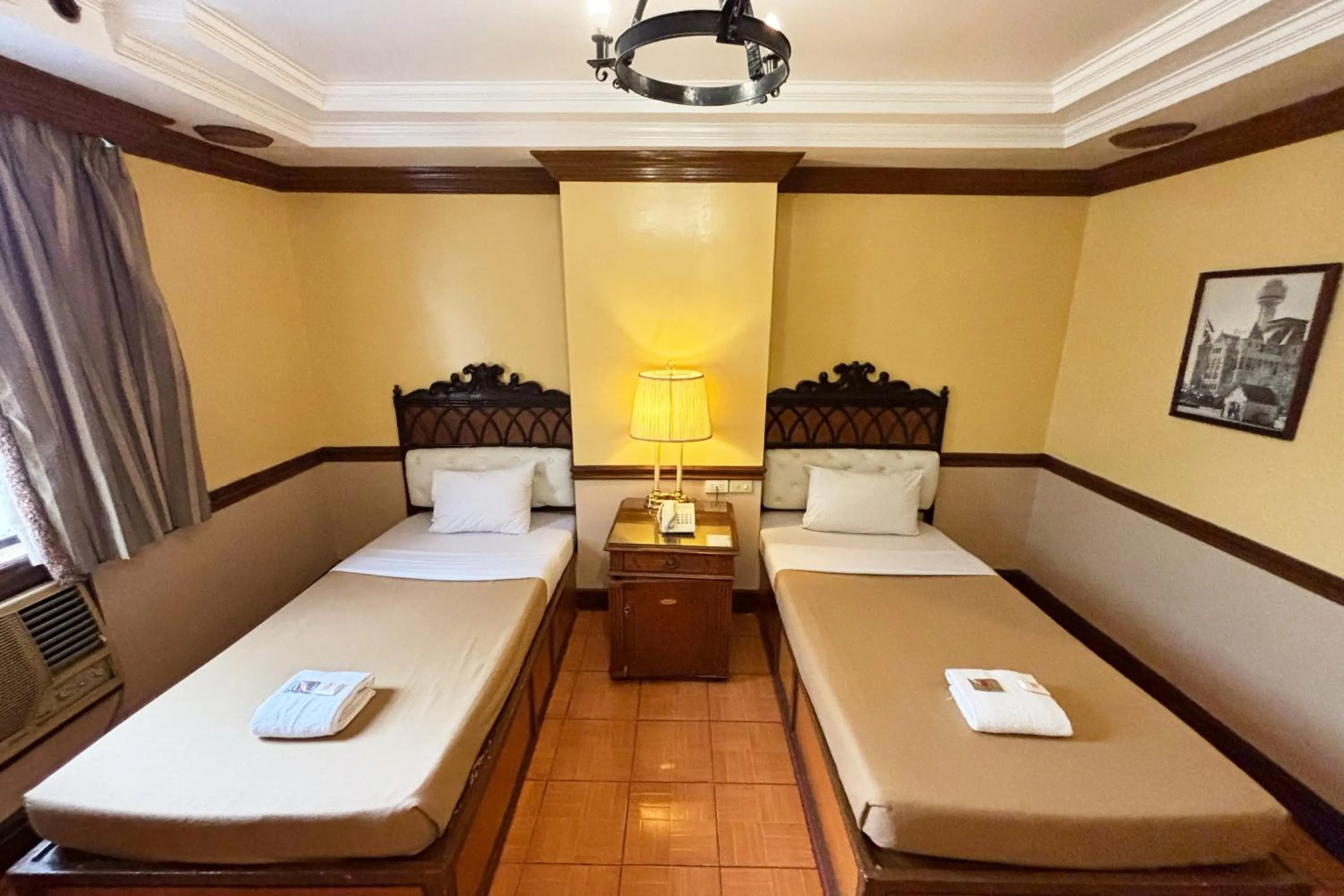 Bed in Camelot Hotel Quezon City powered by Cocotel