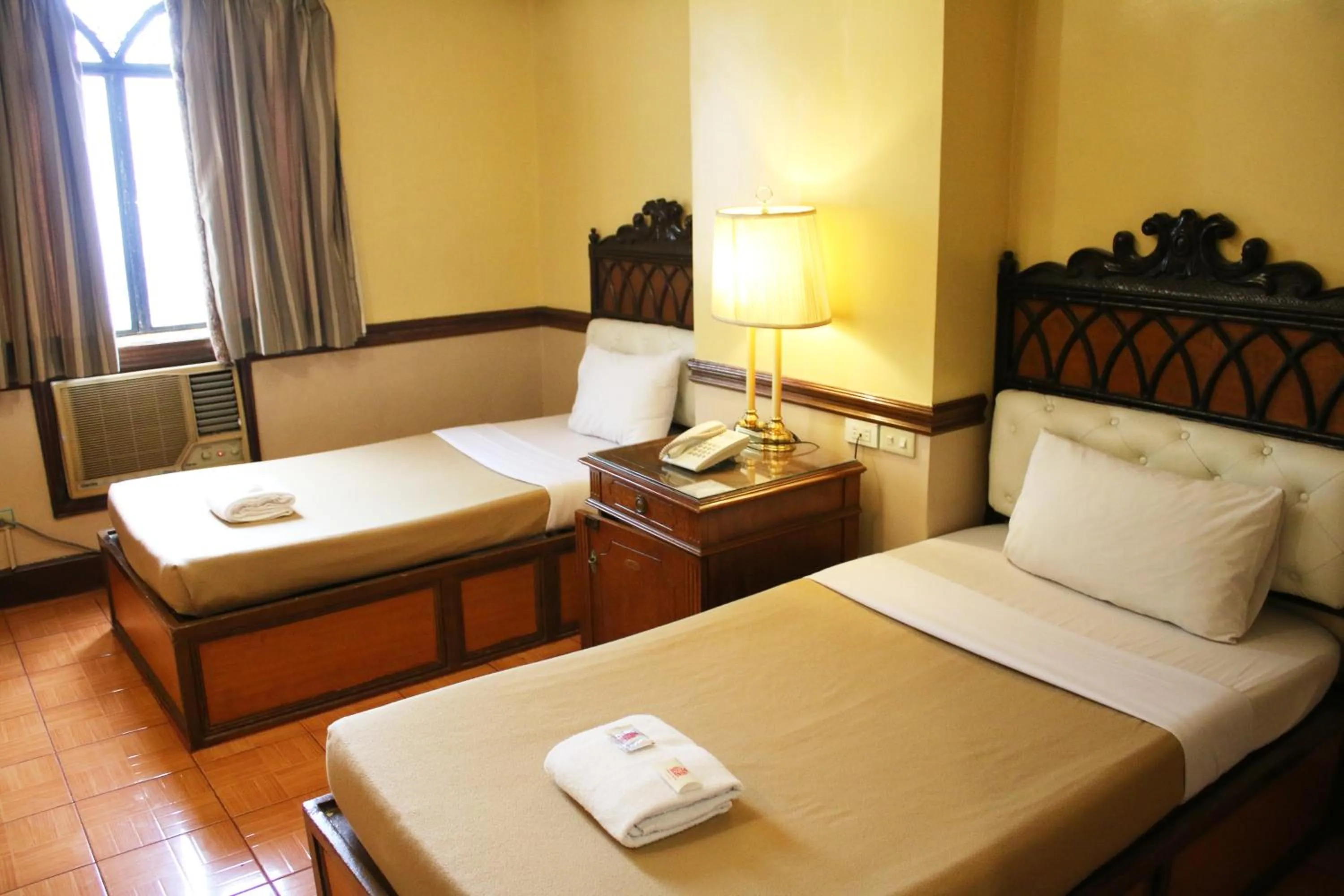 Bed in Camelot Hotel Quezon City powered by Cocotel