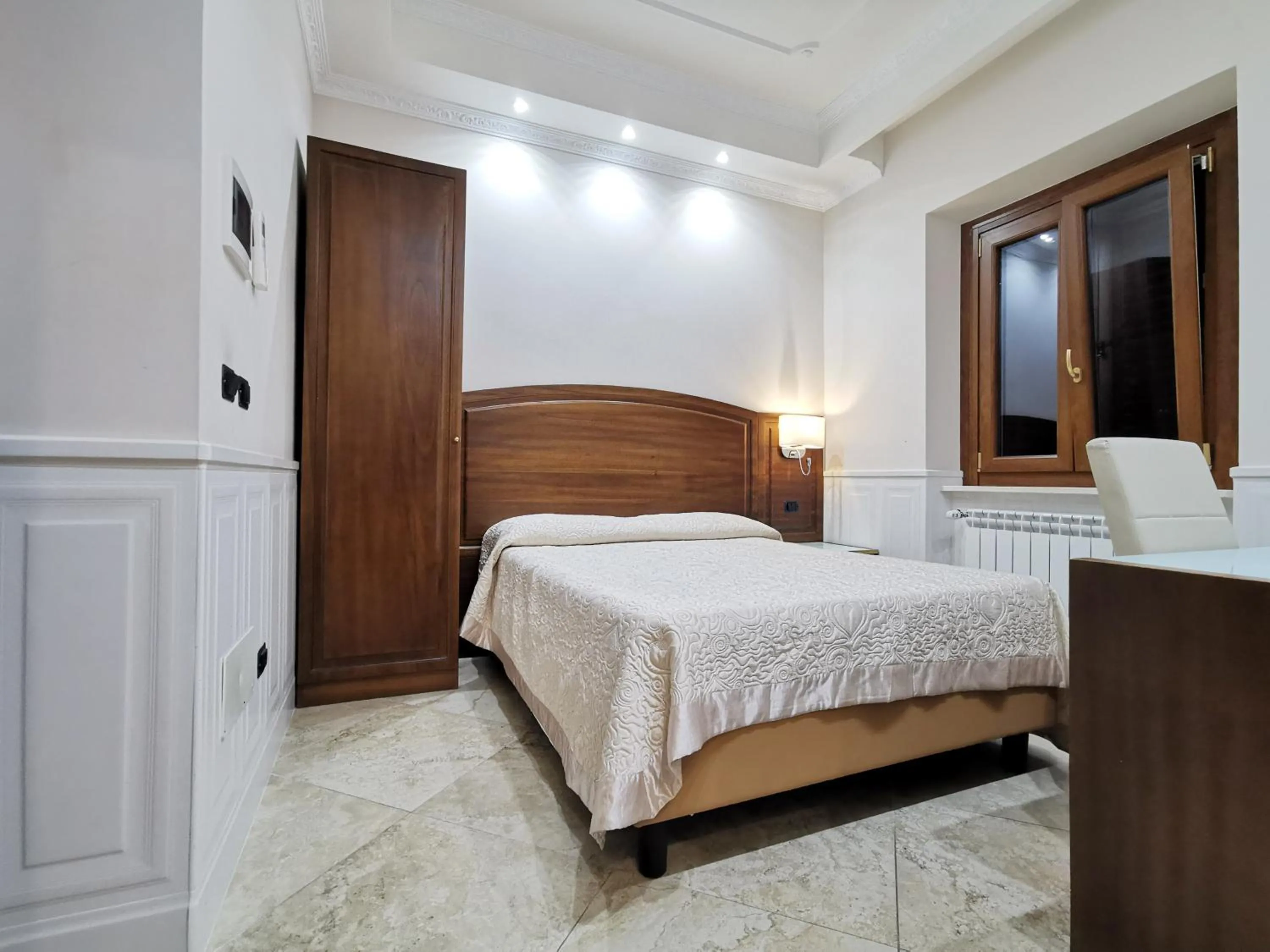 Bed in Hotel Valentino Palace