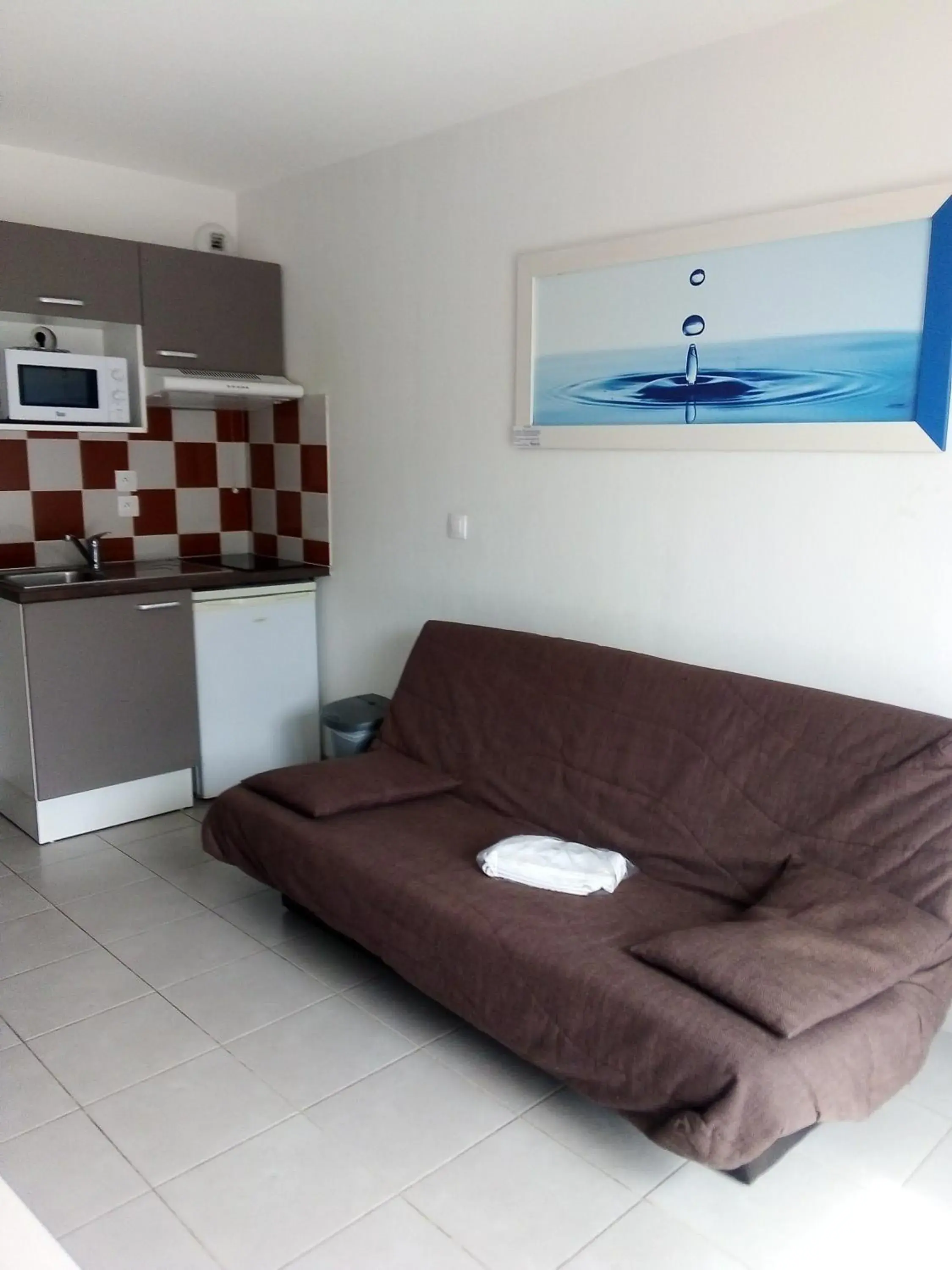 Living room in Résidence Vacancéole - Le Domaine de la Corniche Living room in Résidence Vacancéole - Le Domaine de la Corniche