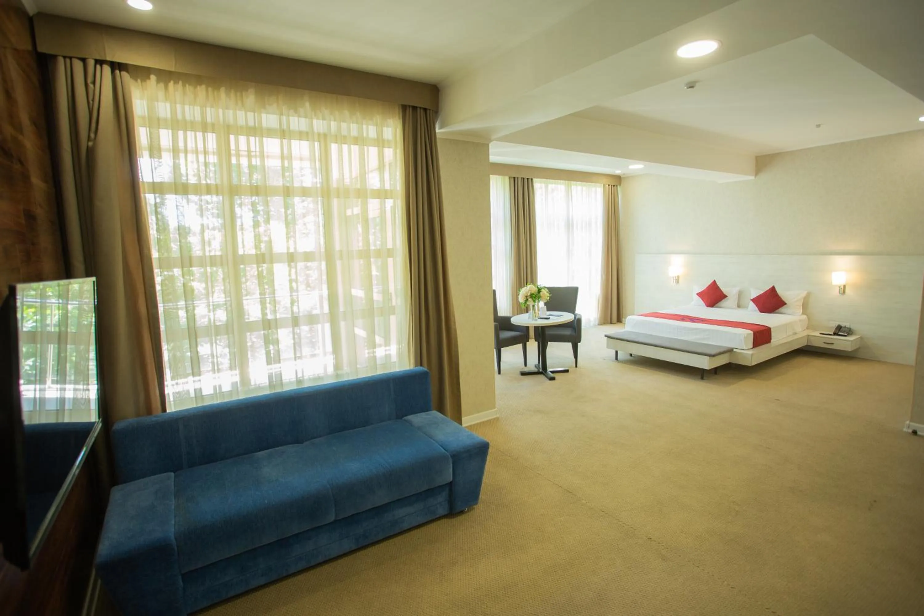 Living room, Bed in B Hotel Bishkek