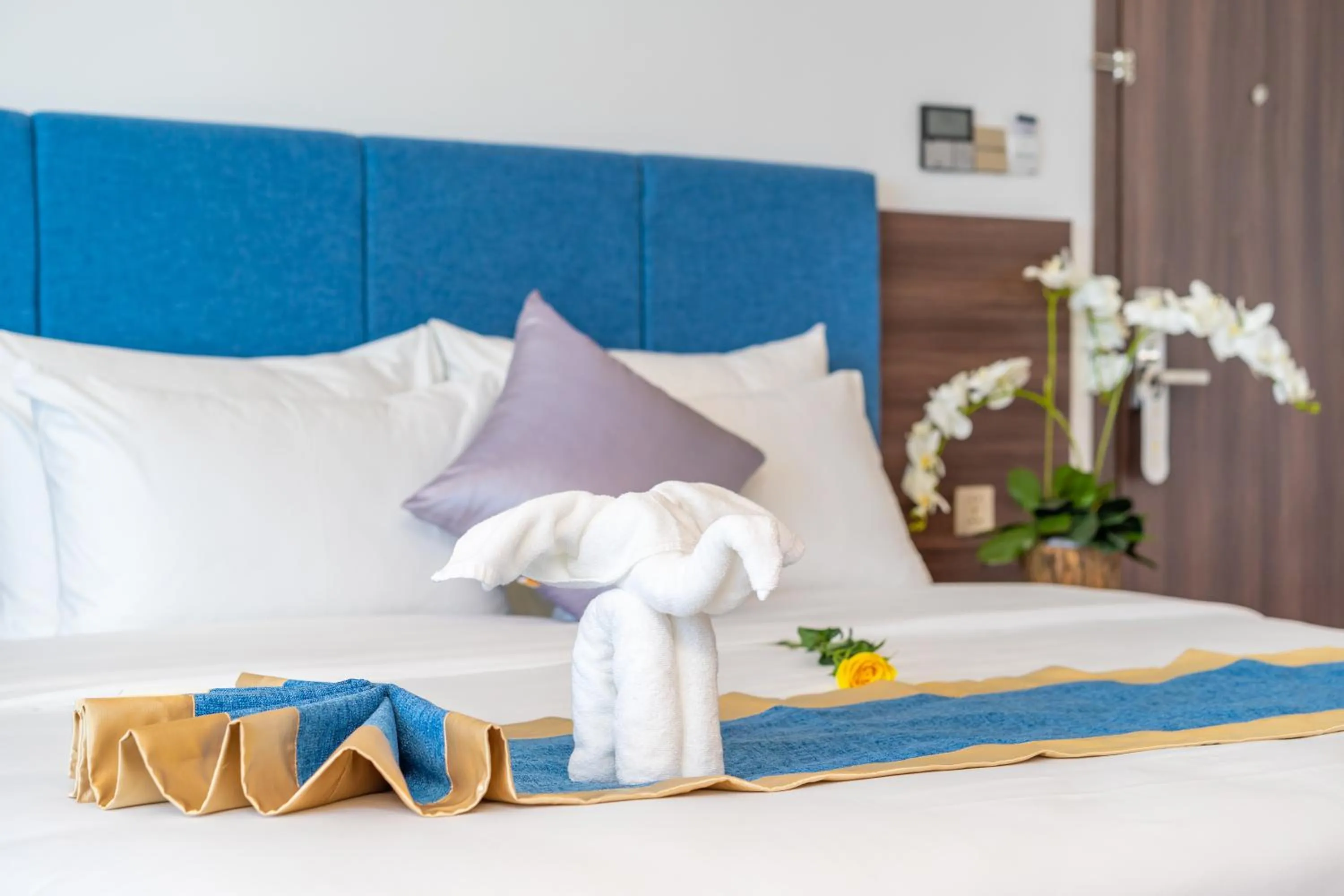 Bed in Grand Gold Hotel