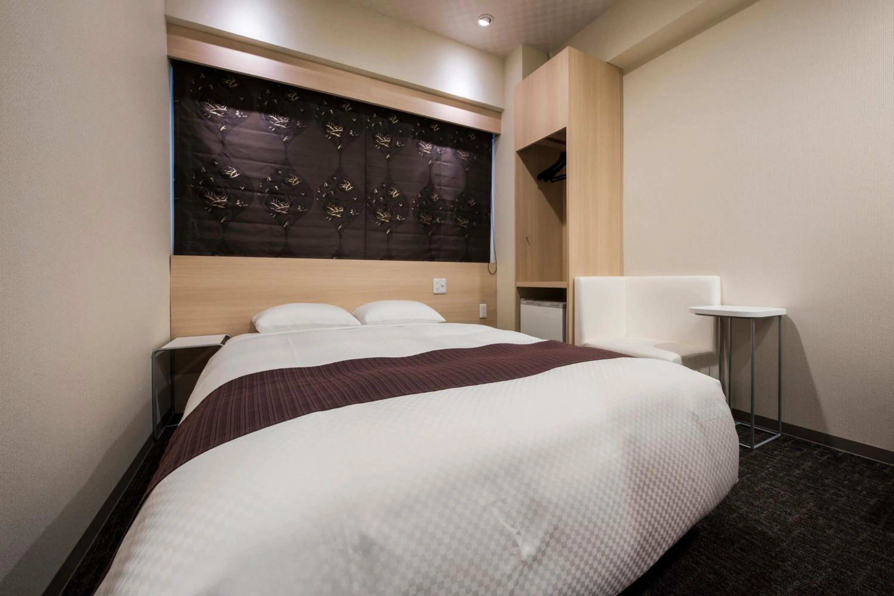 Photo of the whole room, Bed in Nagasaki Bus Terminal Hotel