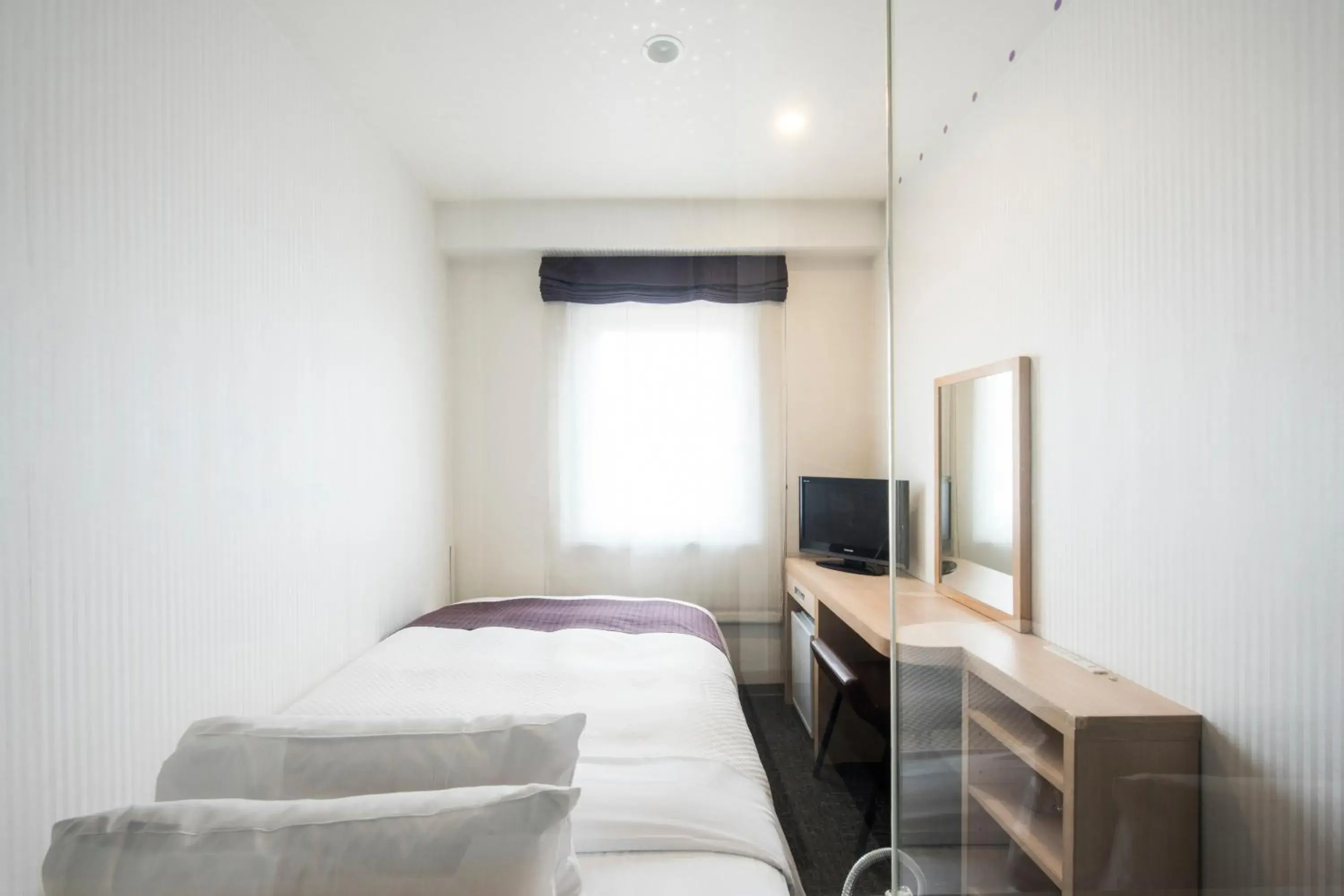 Photo of the whole room, Bed in Nagasaki Bus Terminal Hotel Photo of the whole room, Bed in Nagasaki Bus Terminal Hotel