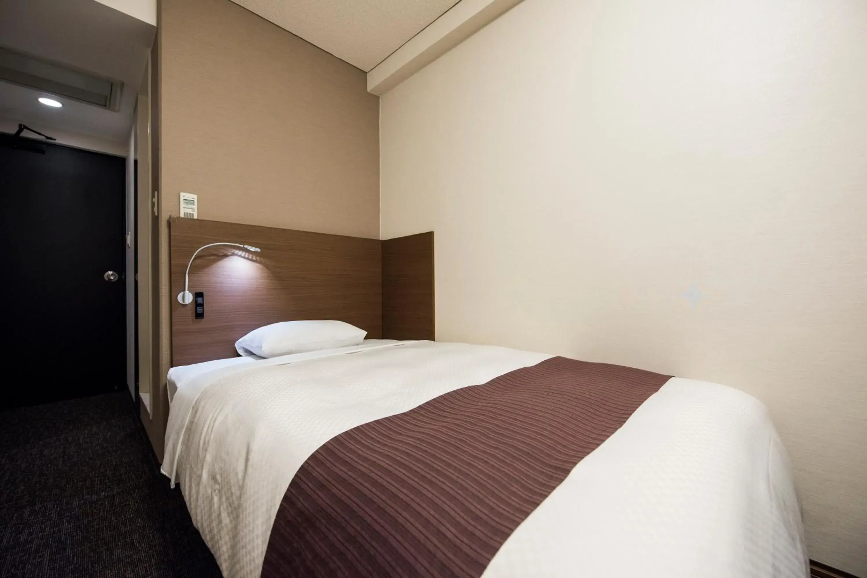 Photo of the whole room, Bed in Nagasaki Bus Terminal Hotel Photo of the whole room, Bed in Nagasaki Bus Terminal Hotel