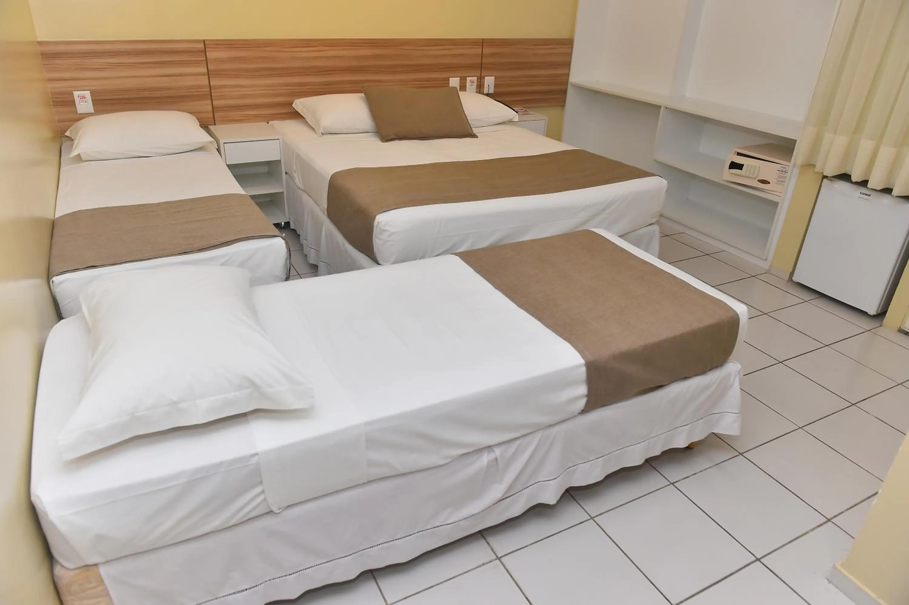 Bed in Hotel Três Caravelas