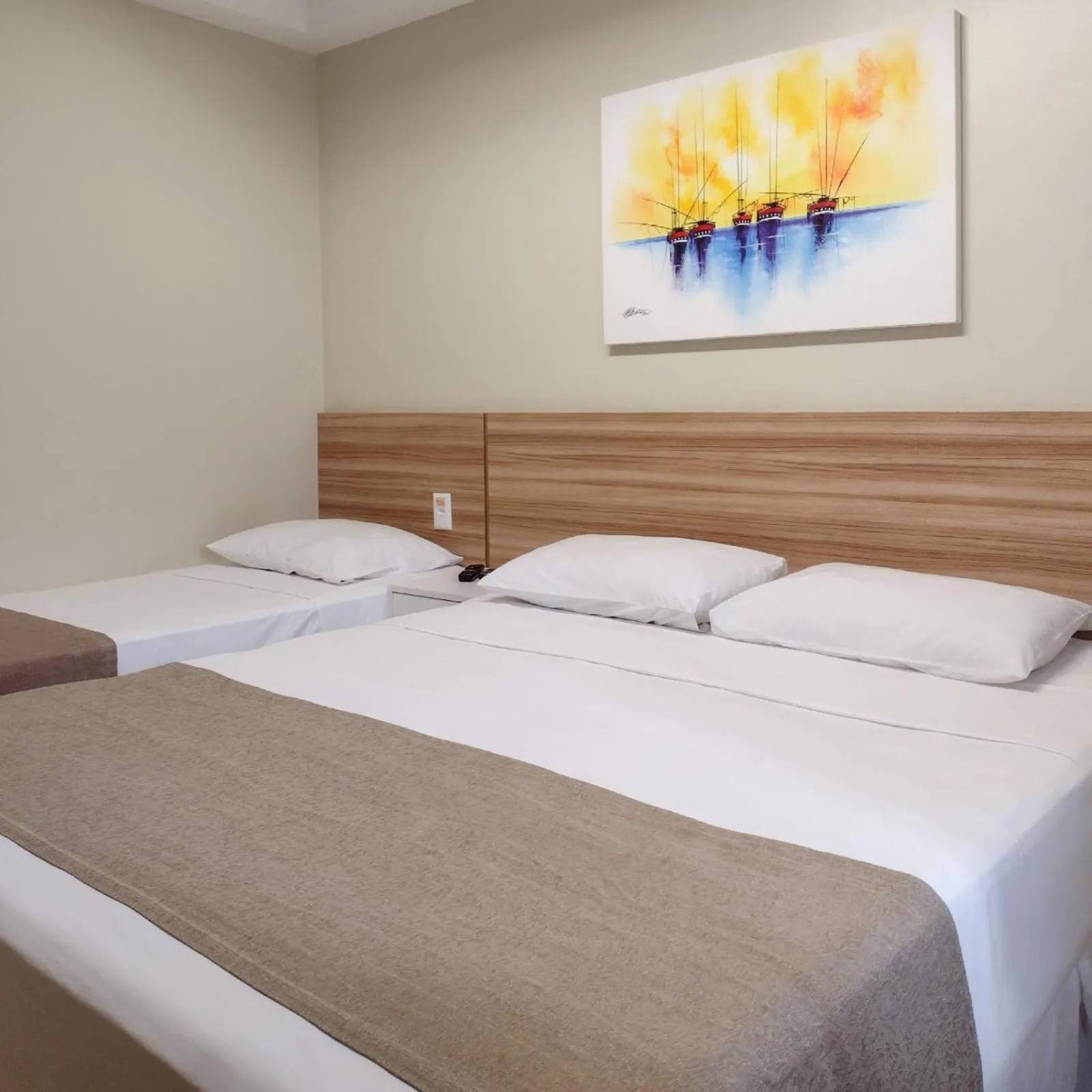 Bed in Hotel Três Caravelas