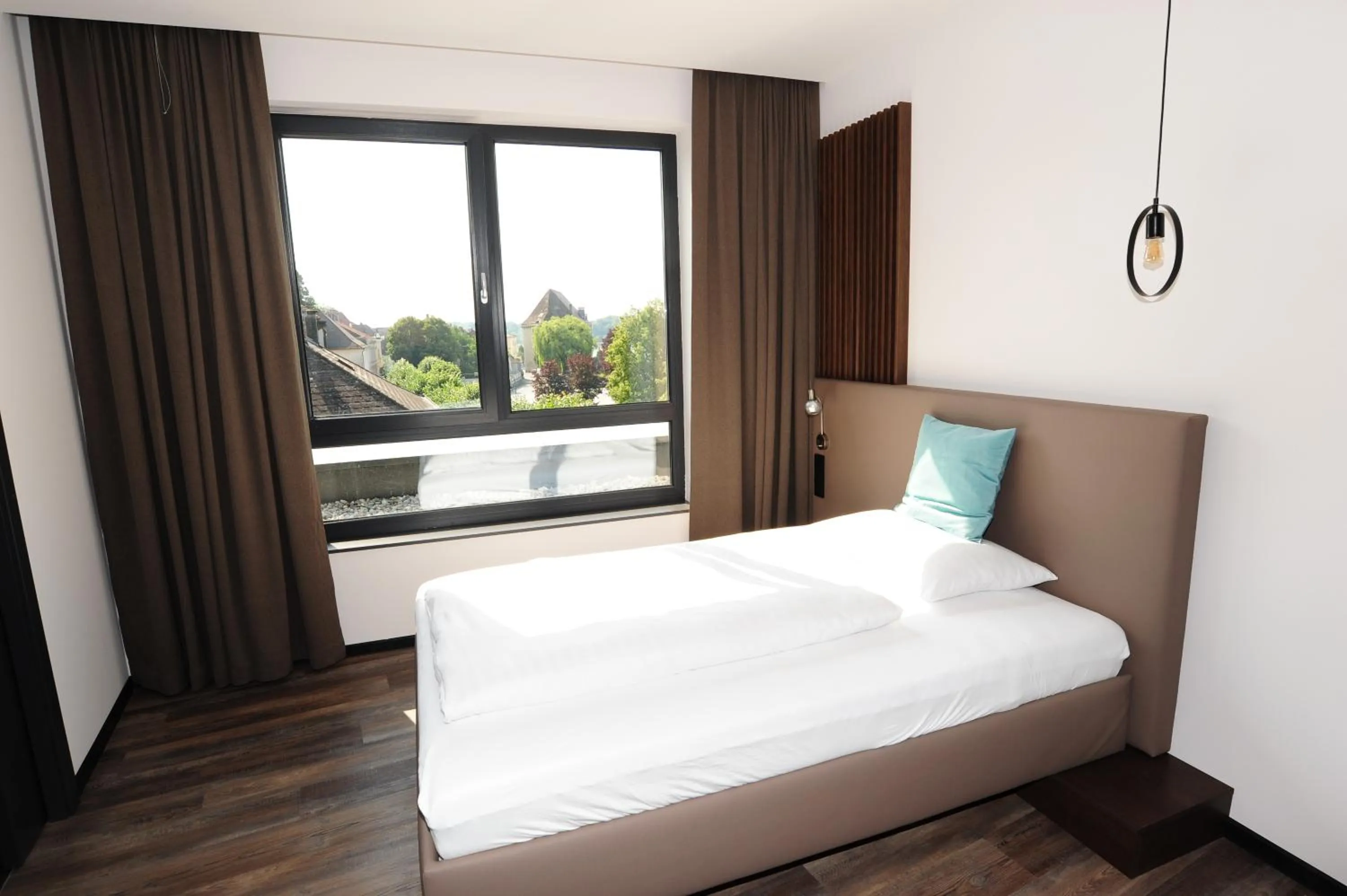 Photo of the whole room, Bed in Hotel Donauhof Mauthausen