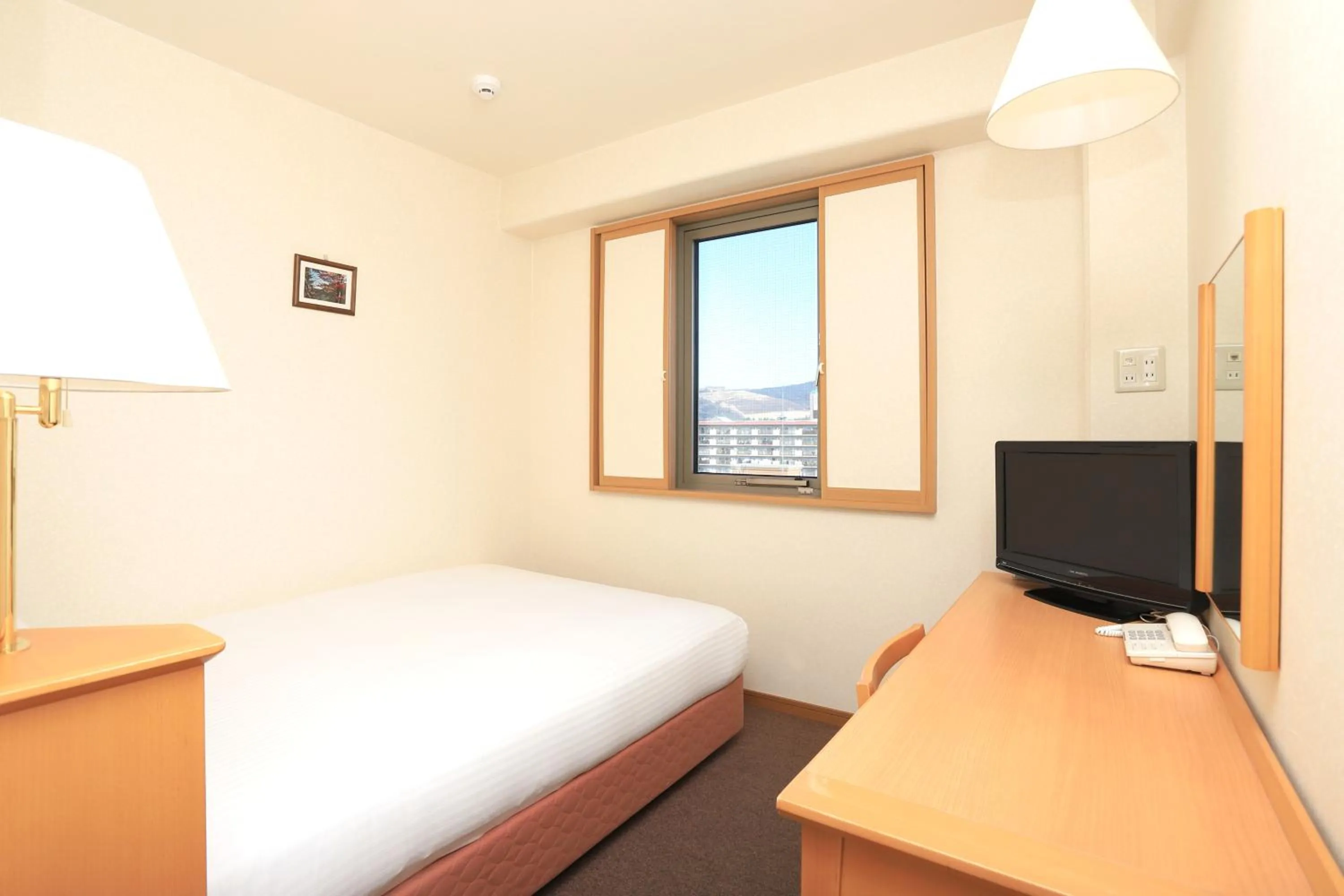 Bed in Smile Hotel Nara