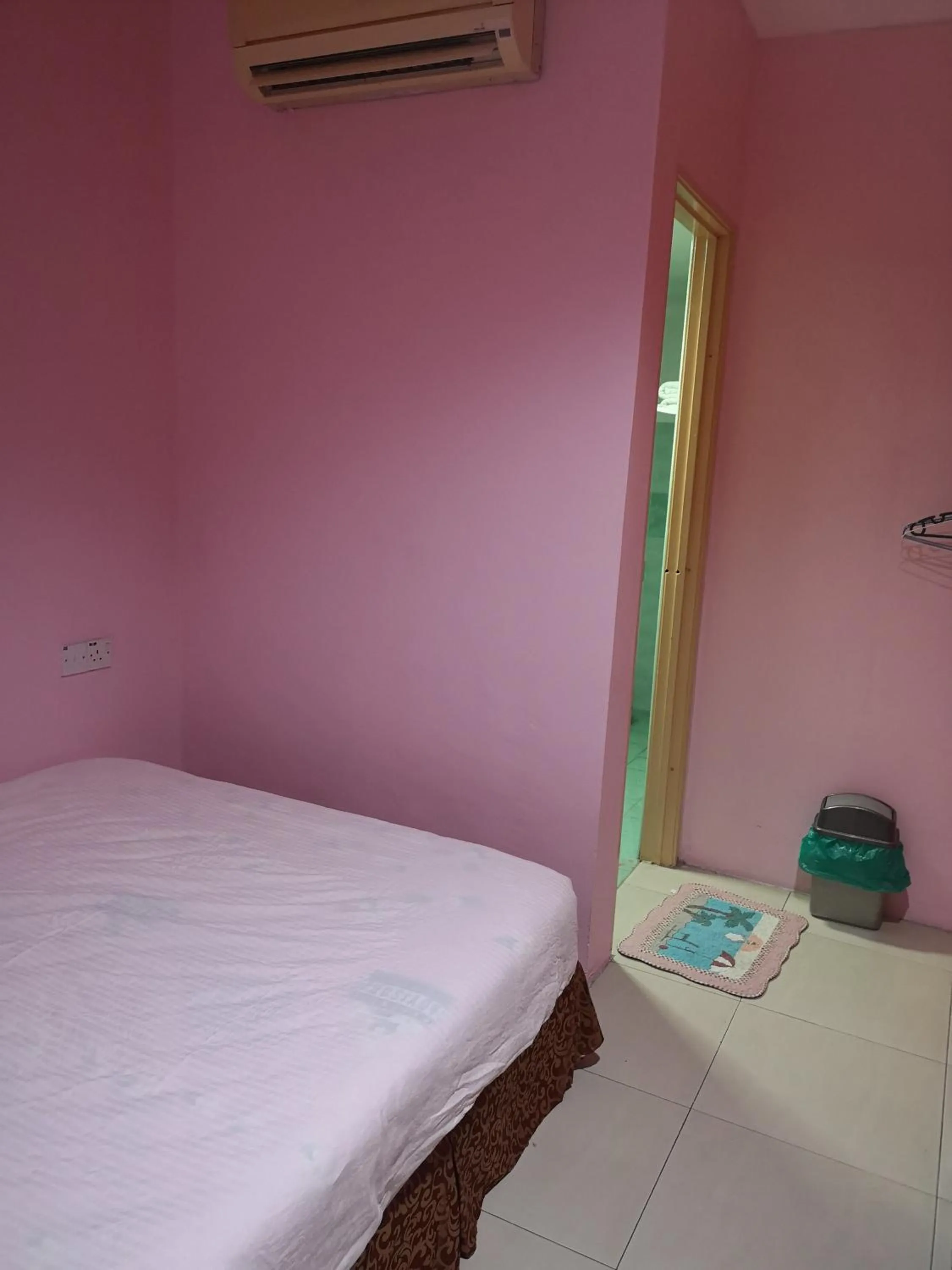 Bed in Home Inn Hotel