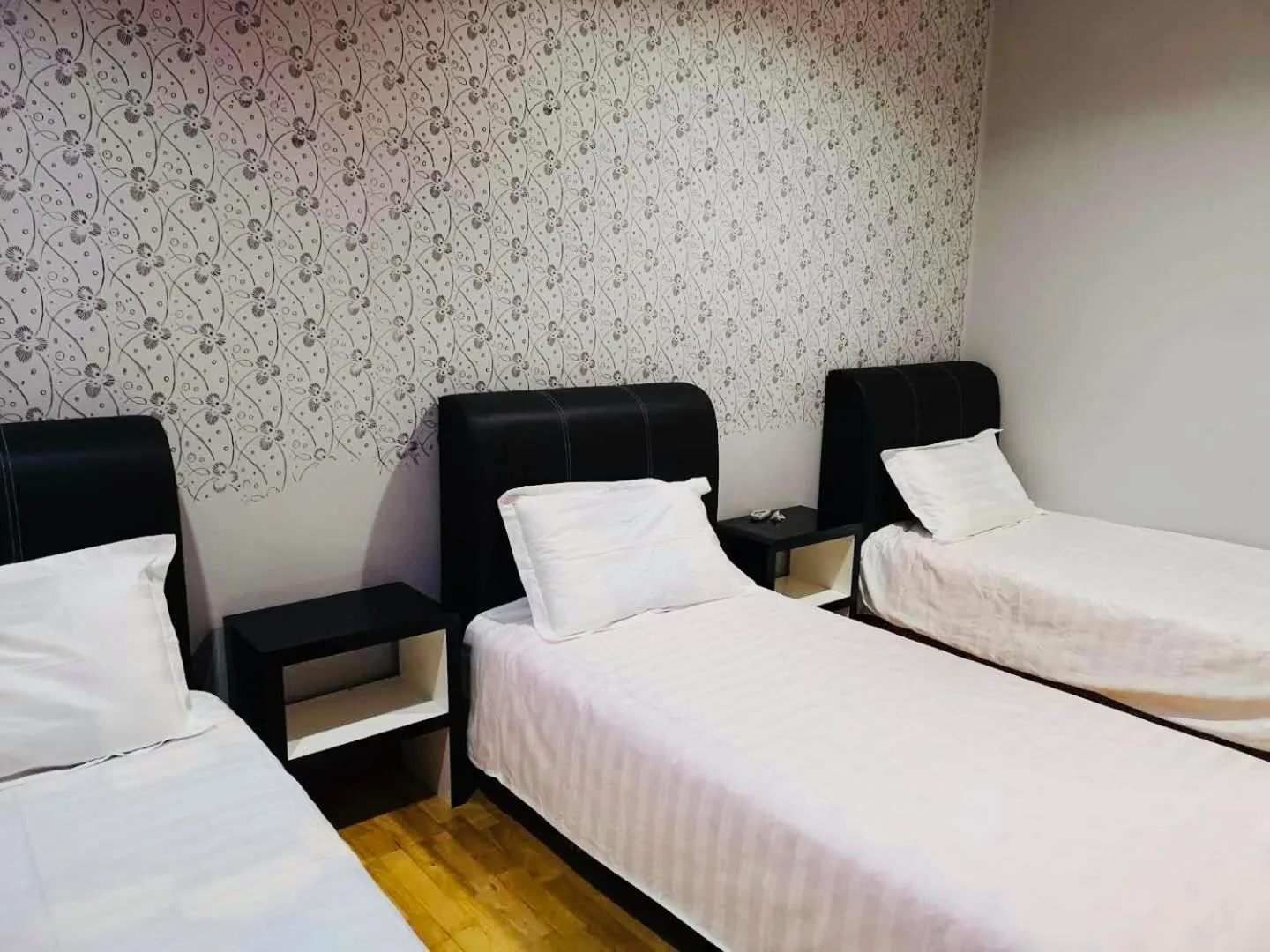 Bed in Home Inn Hotel