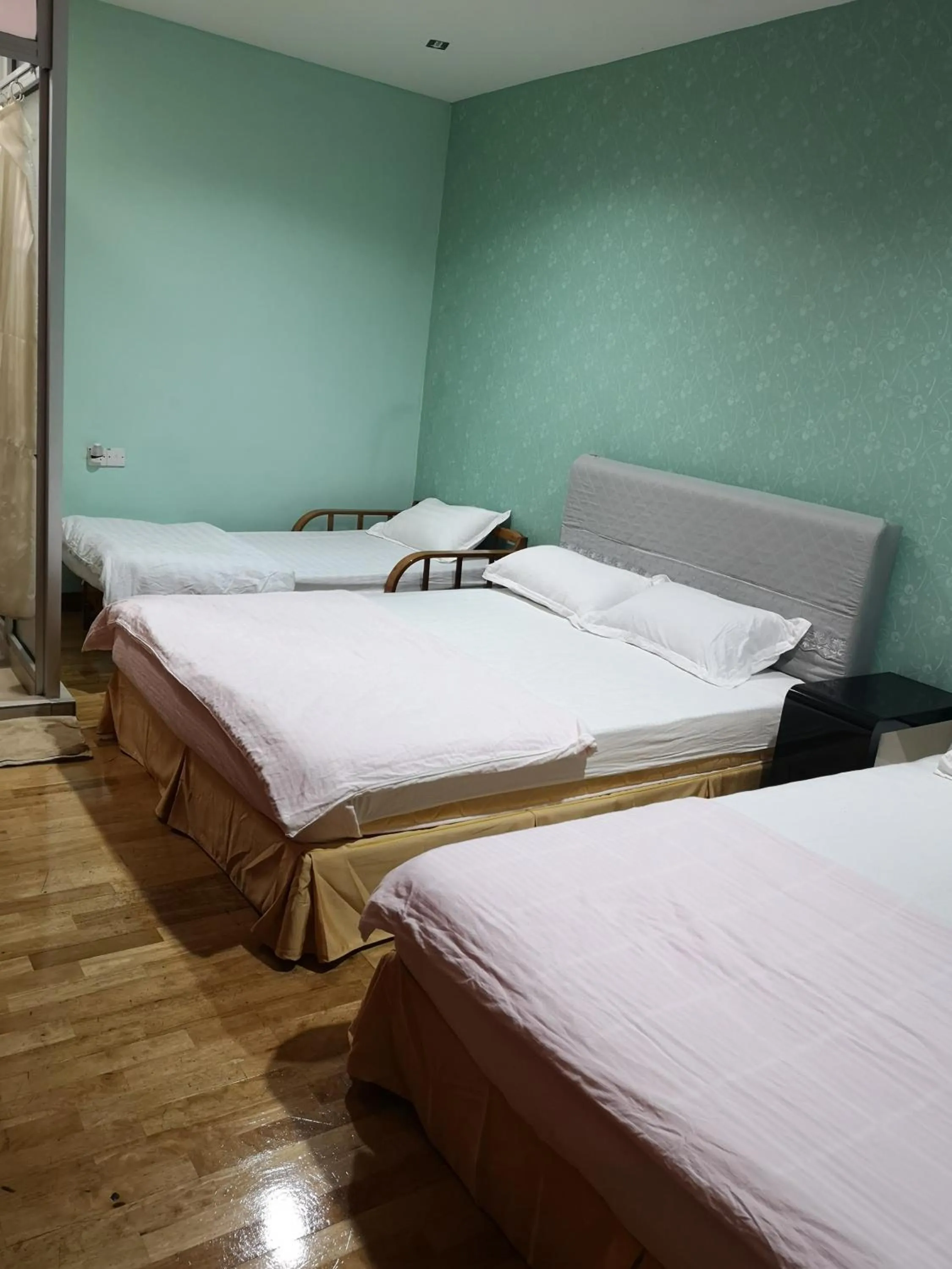 Bed in Home Inn Hotel