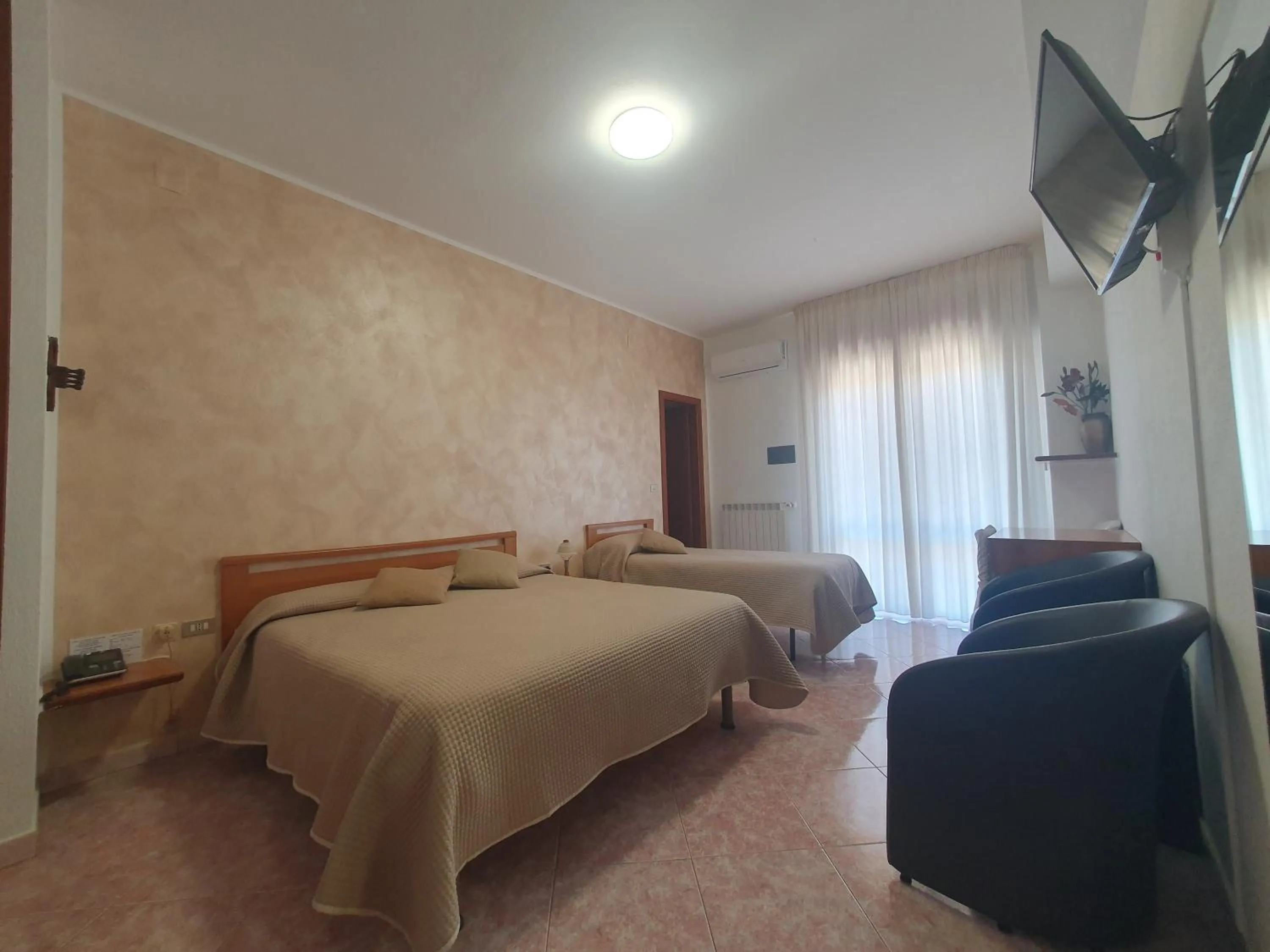 Photo of the whole room, Bed in Hotel Ristorante SUPERSONIK