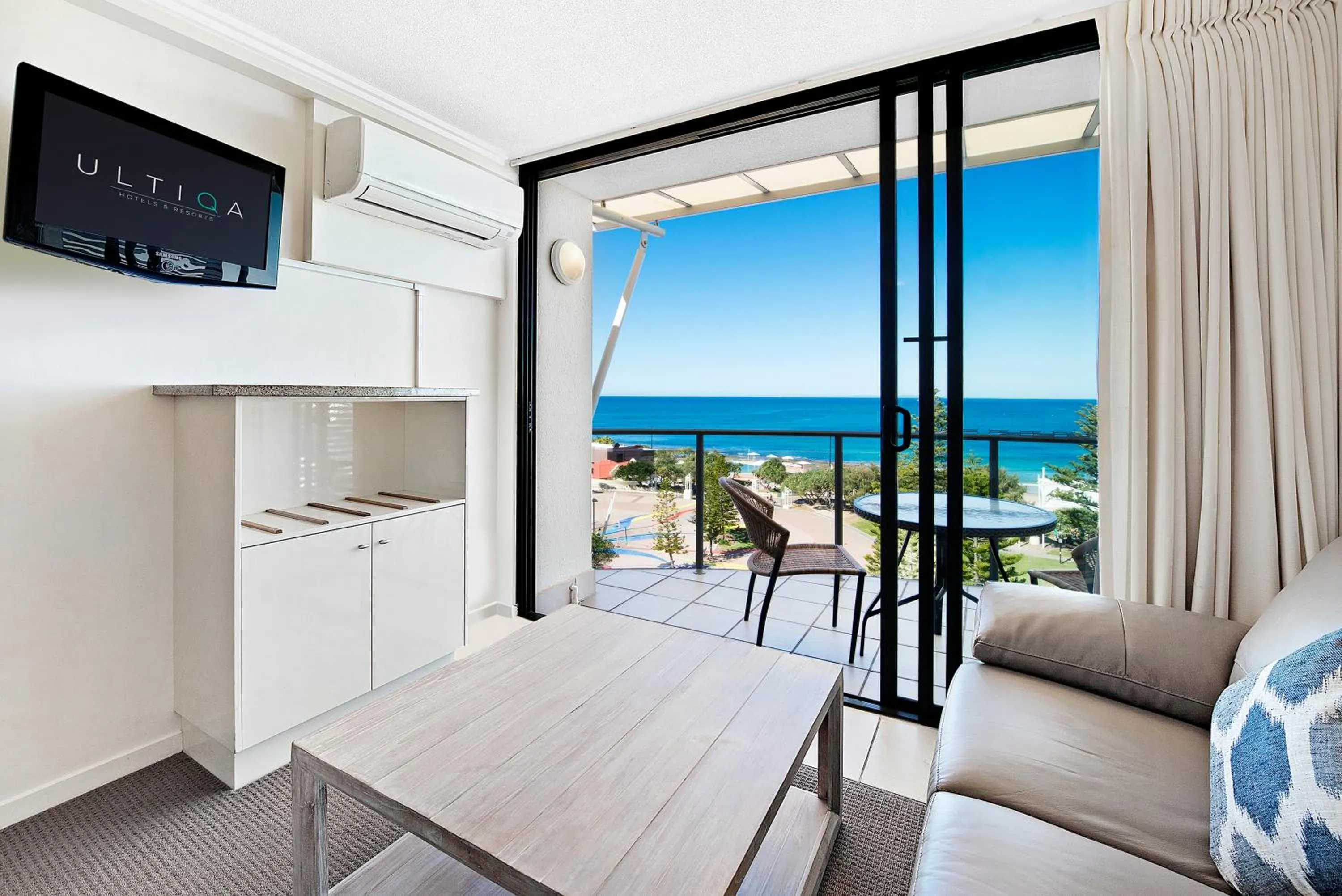 Living room, Bed in ULTIQA Shearwater Resort