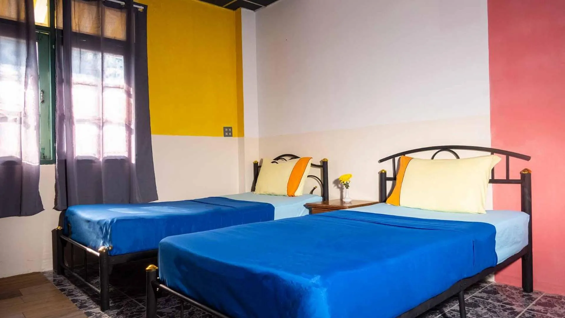 Bed in Sabina Guesthouse Kamala