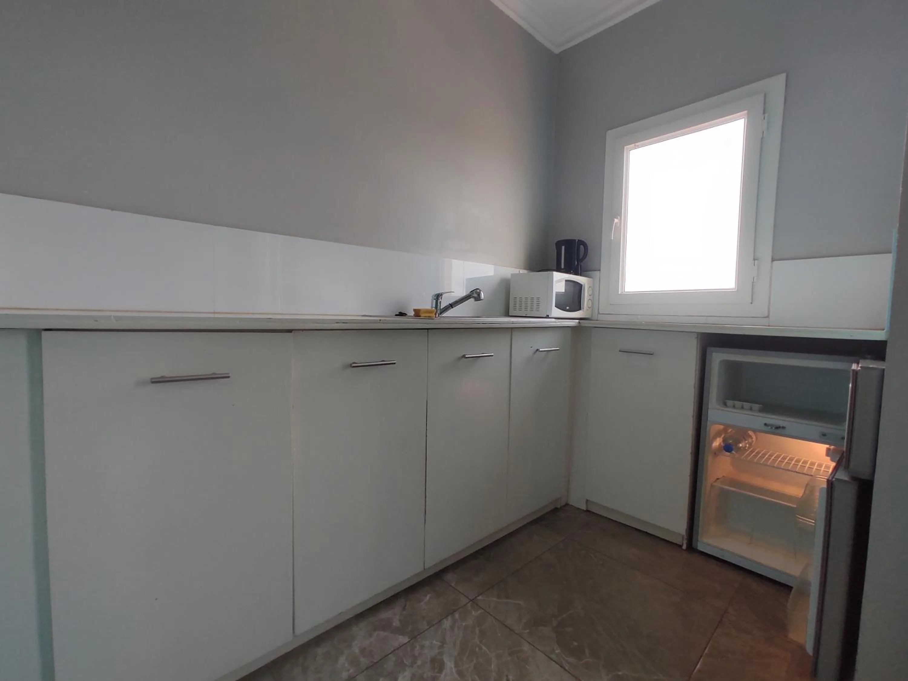 Kitchen or kitchenette in Residence Jardin Tropical