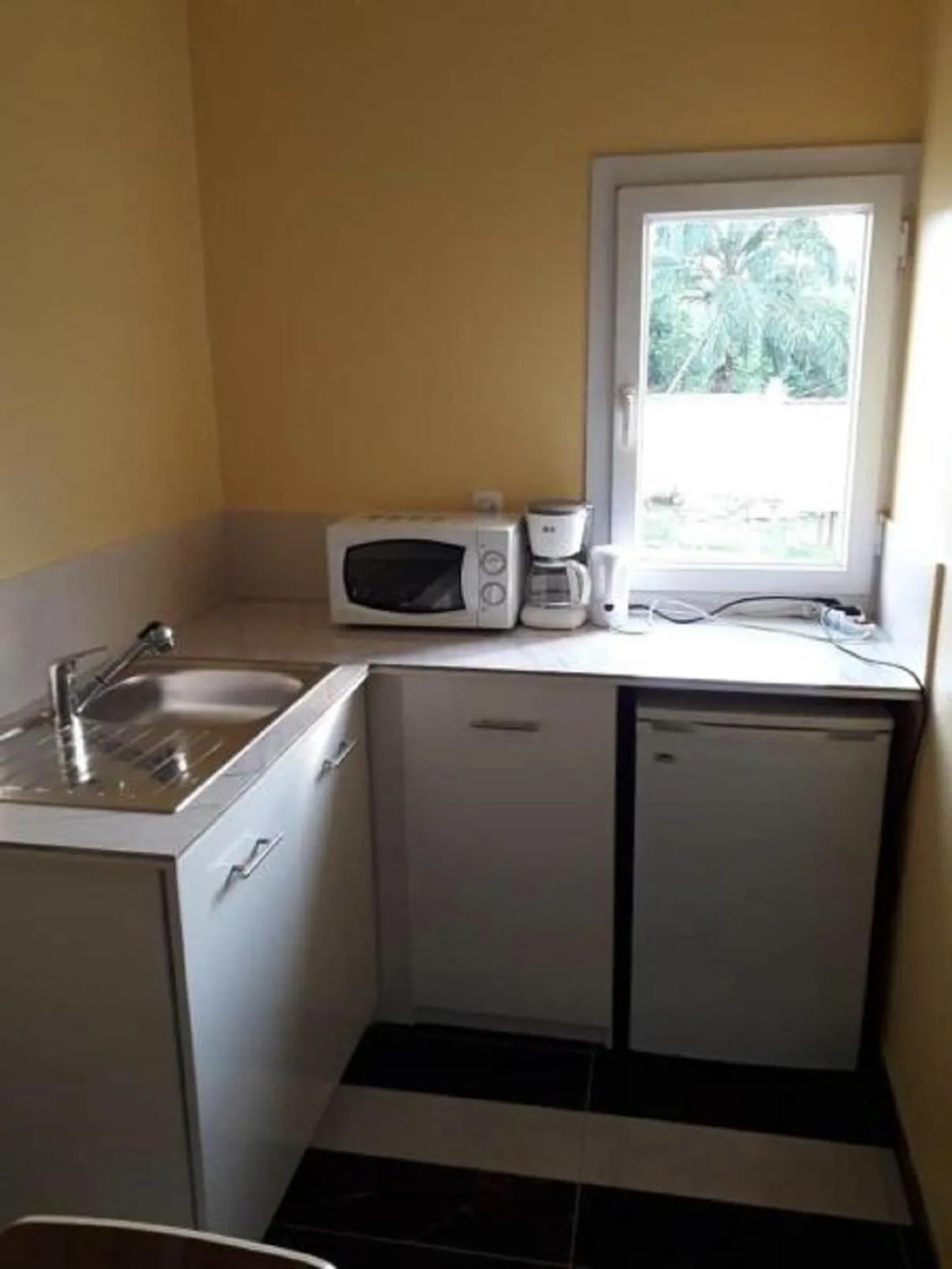 Kitchen or kitchenette in Residence Jardin Tropical