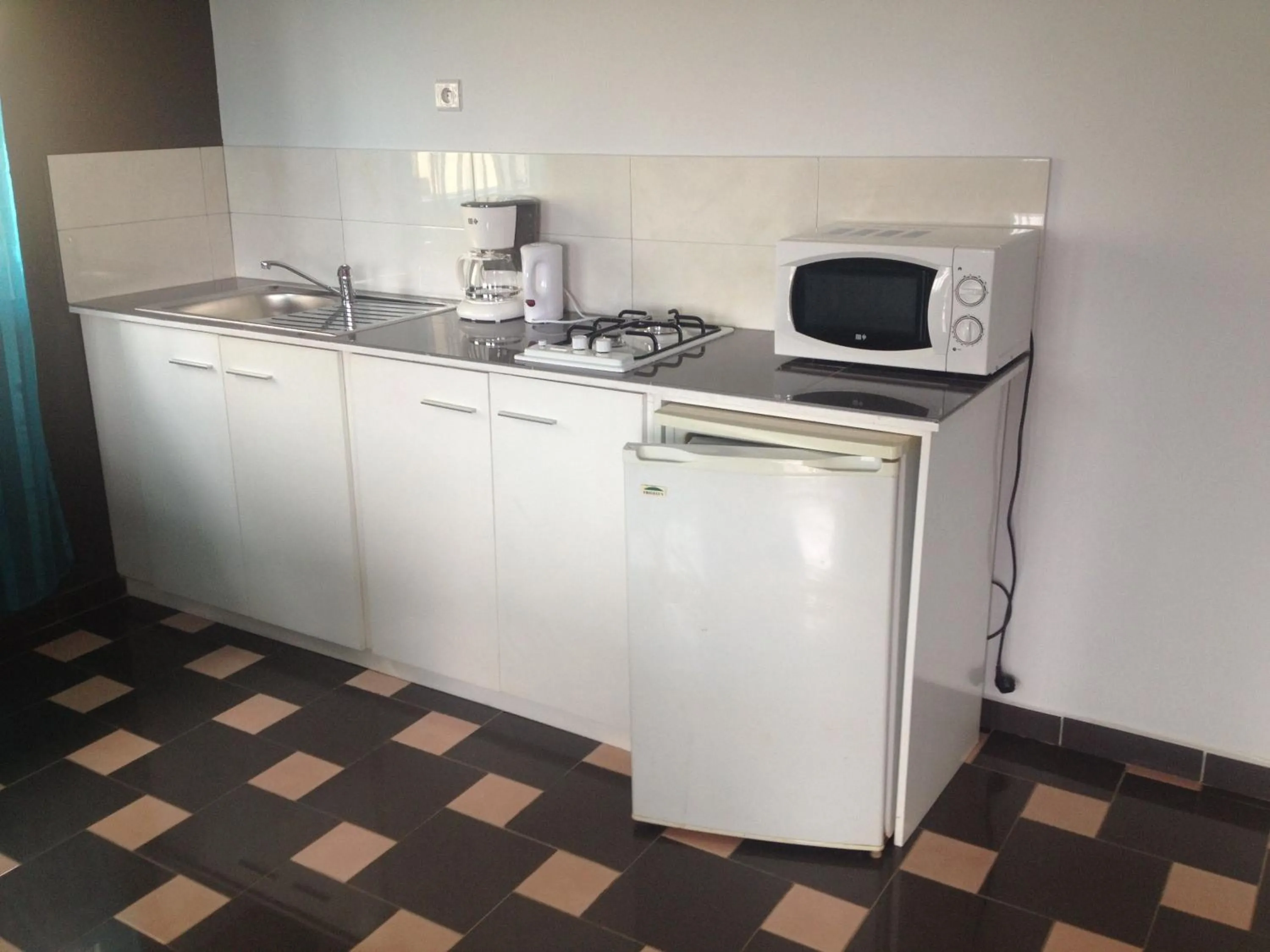 Kitchen or kitchenette in Residence Jardin Tropical