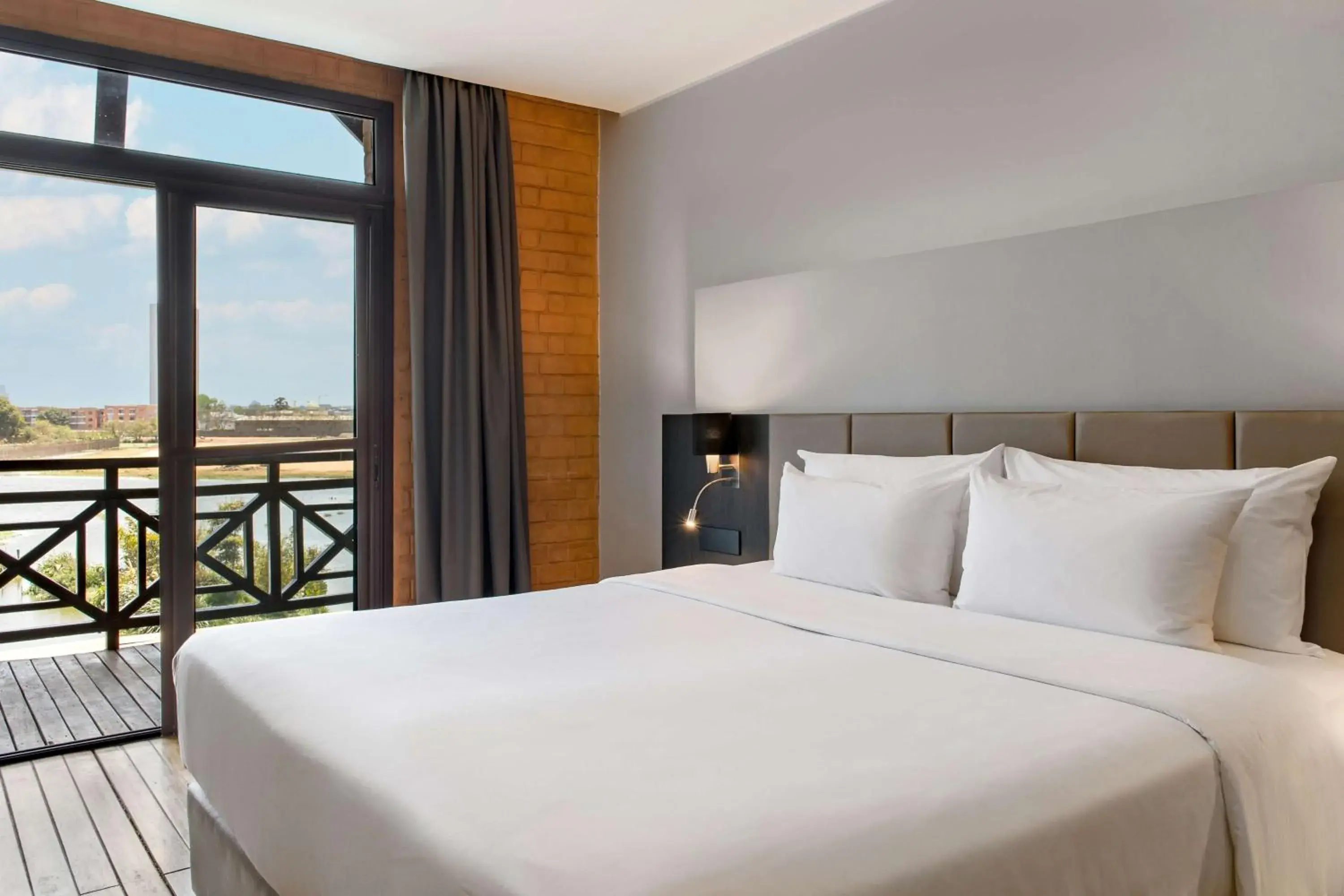 Photo of the whole room, Bed in Radisson Hotel Tamboho Waterfront Antananarivo Photo of the whole room, Bed in Radisson Hotel Tamboho Waterfront Antananarivo