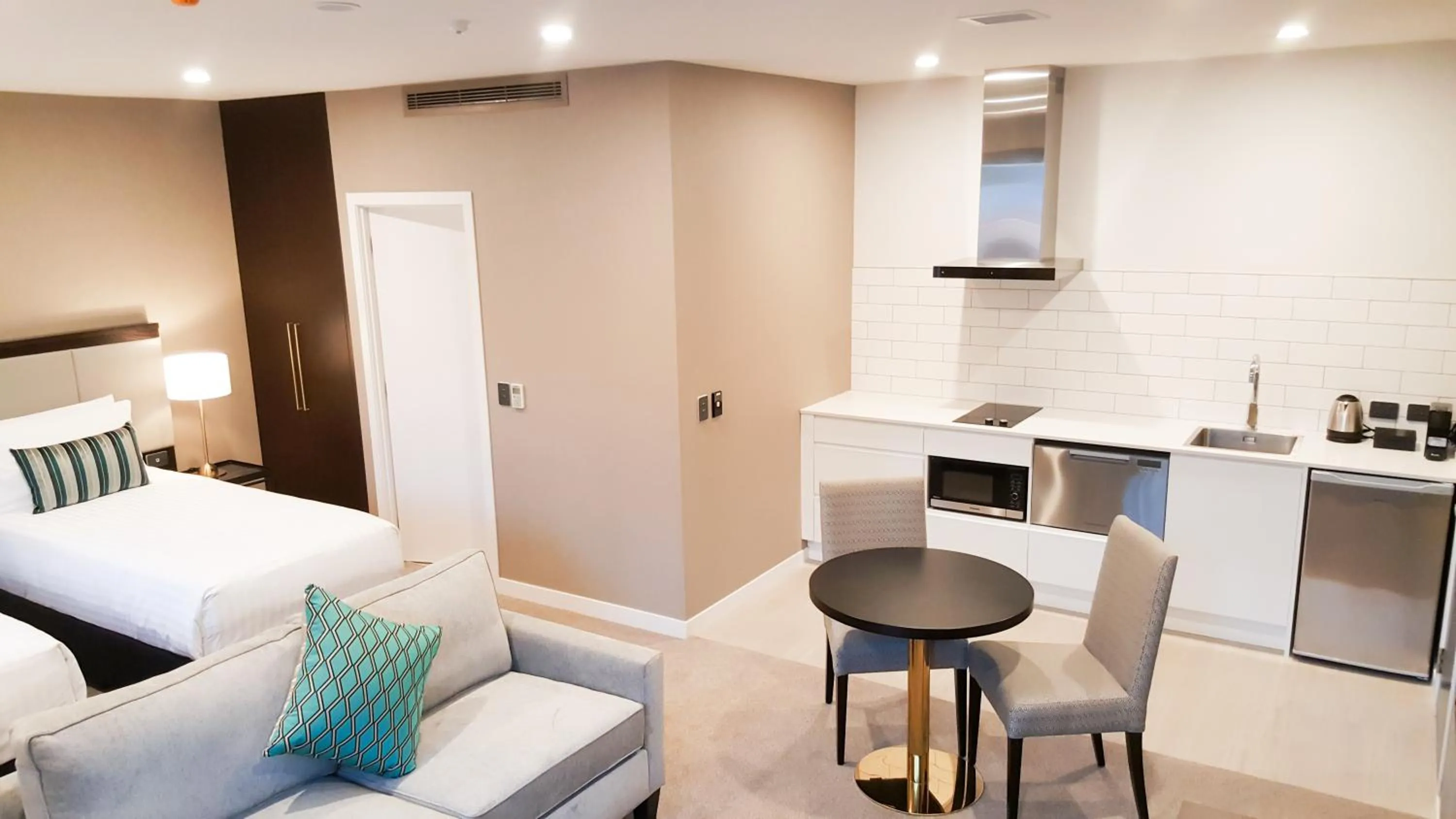 Living room, Bed in The Sebel Auckland Manukau