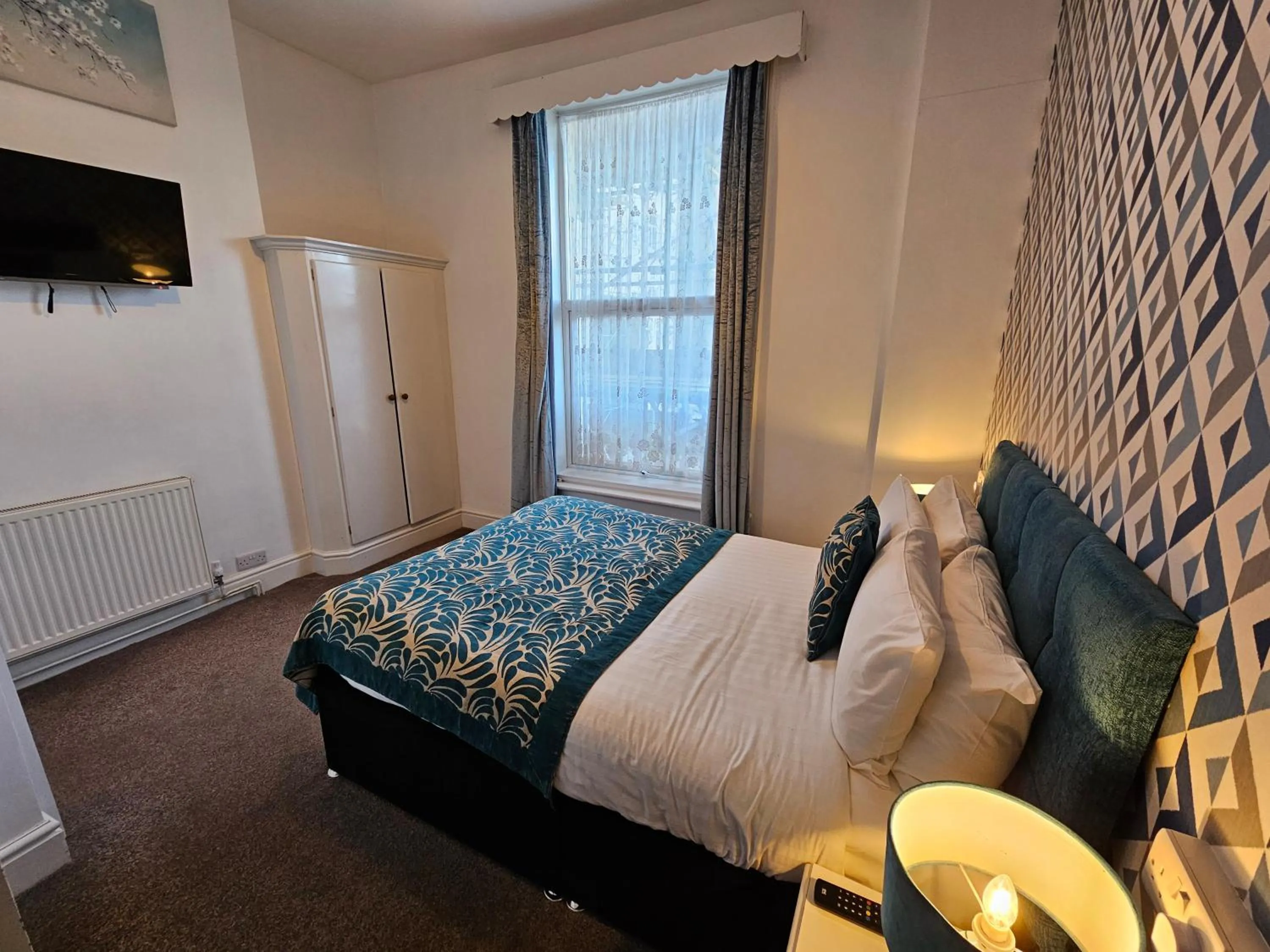 Bed in Rivelyn Hotel Bar & Restaurant