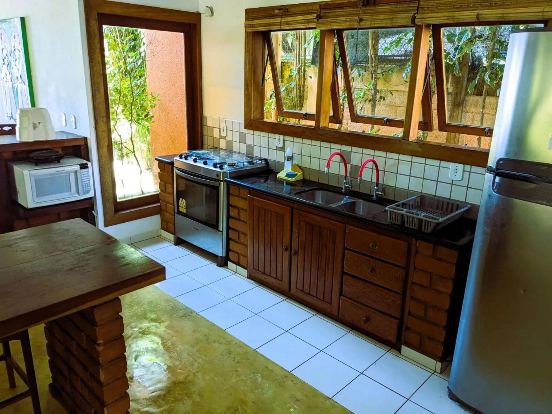 Kitchen or kitchenette in Residence Maria Vittoria Praia Arraial