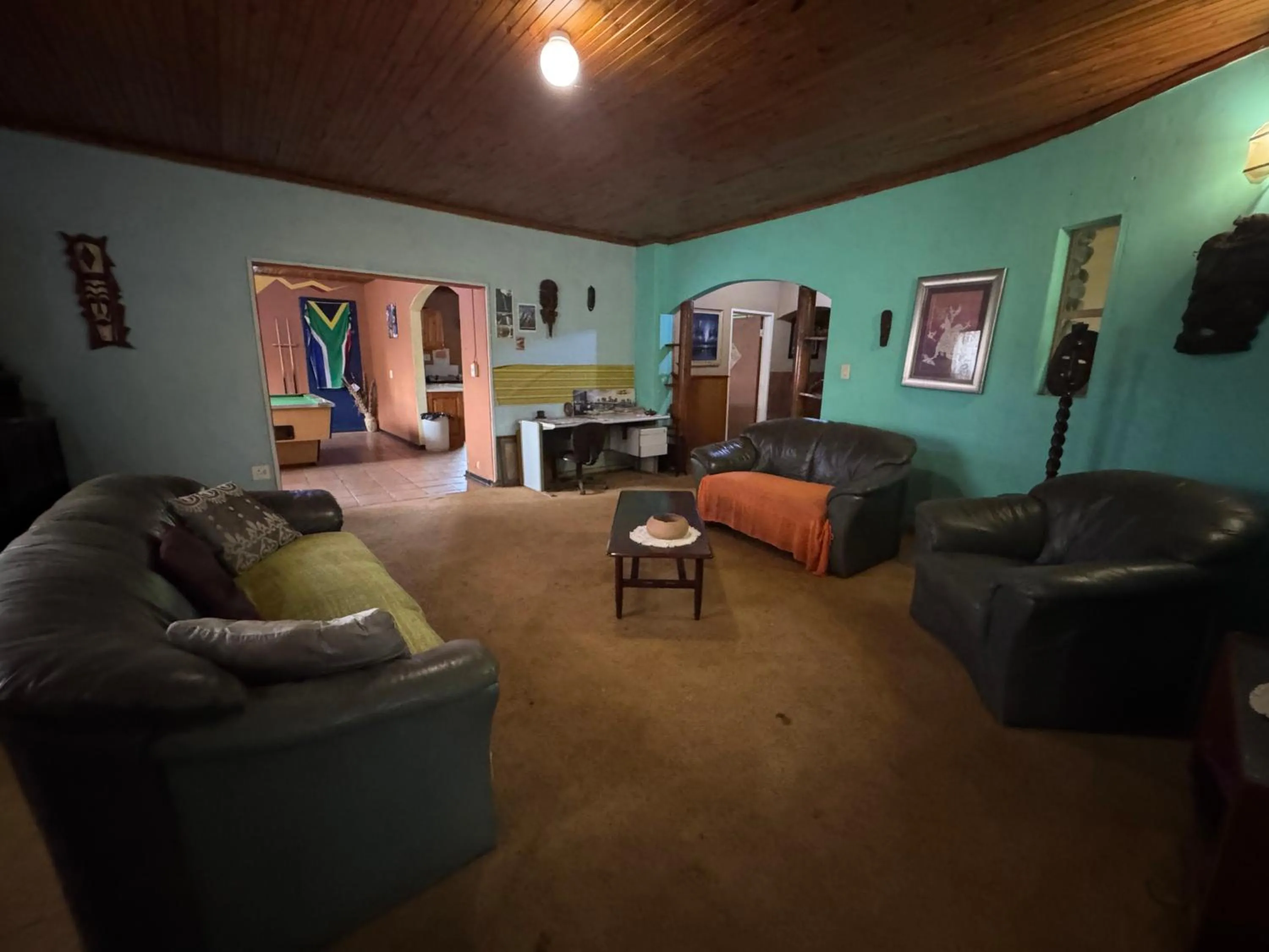 Communal lounge/ TV room in Sabie Gypsy's Backpackers