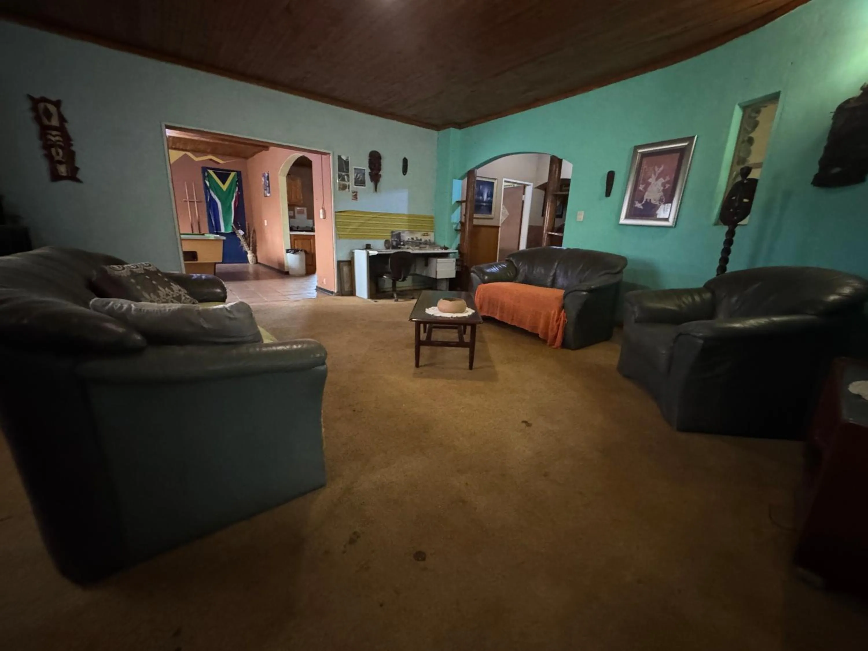 Communal lounge/ TV room in Sabie Gypsy's Backpackers