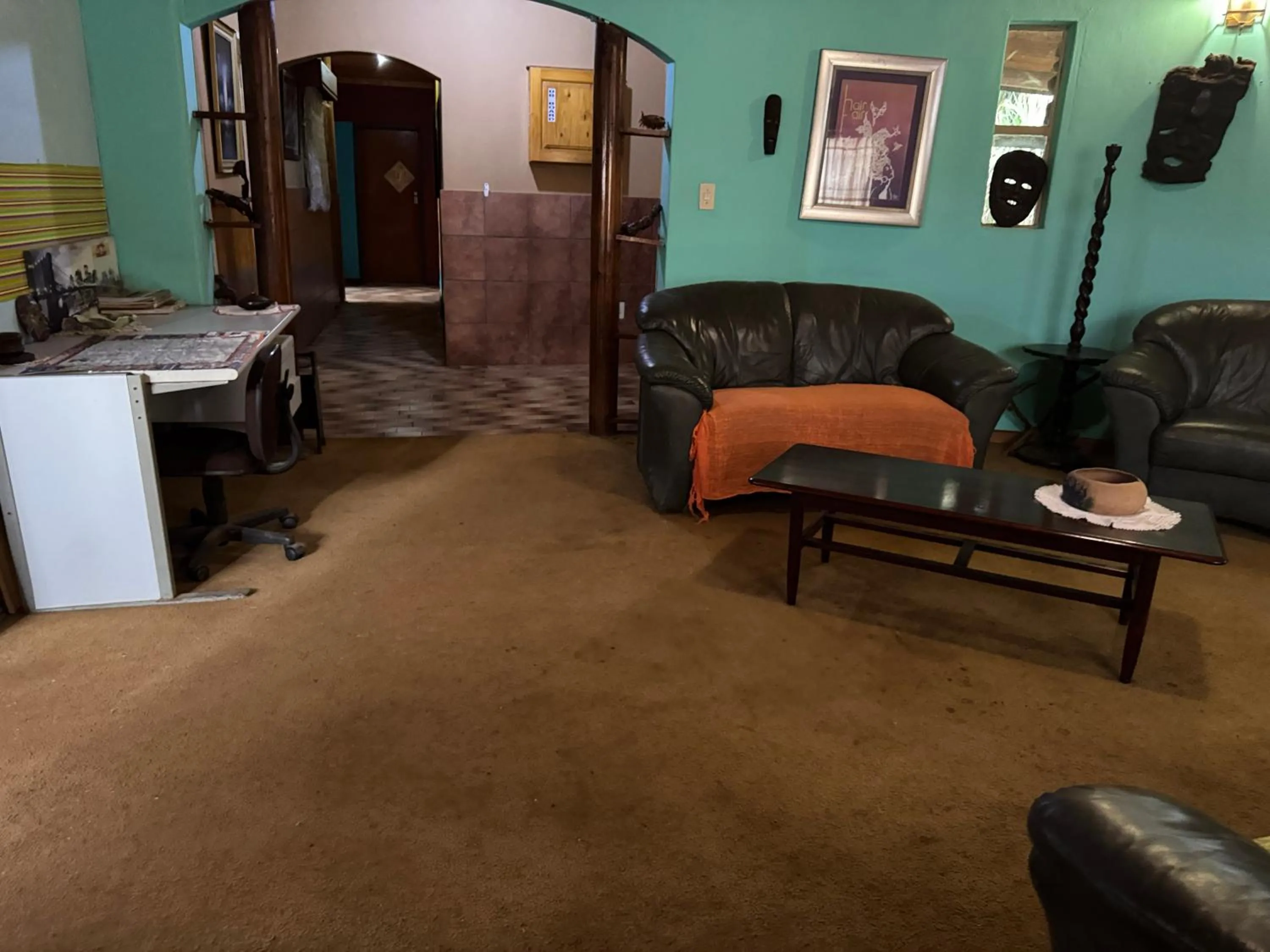 Communal lounge/ TV room in Sabie Gypsy's Backpackers